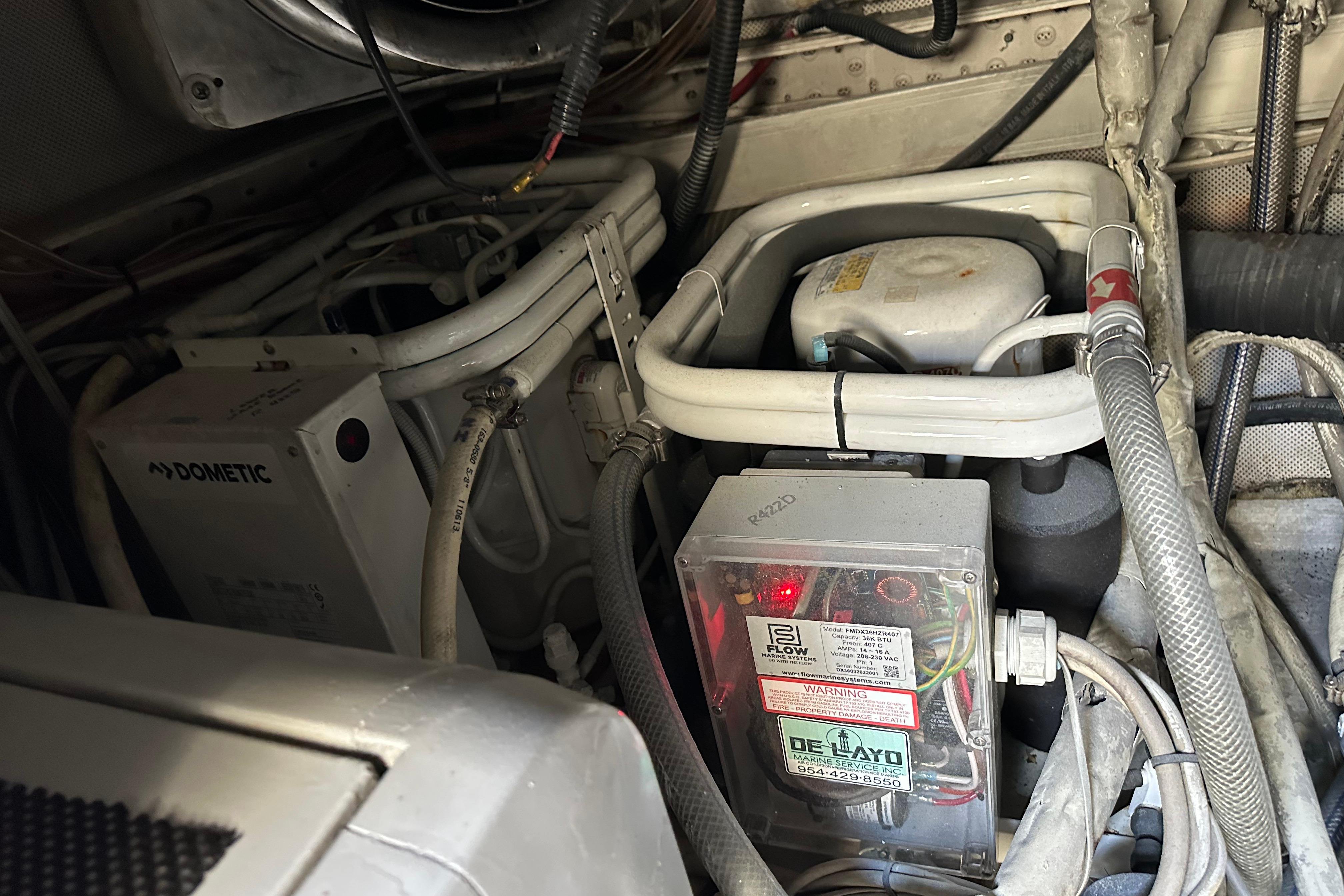 Engine room of a 2004 Azimut 55E yacht, featuring Dometic equipment and wiring.