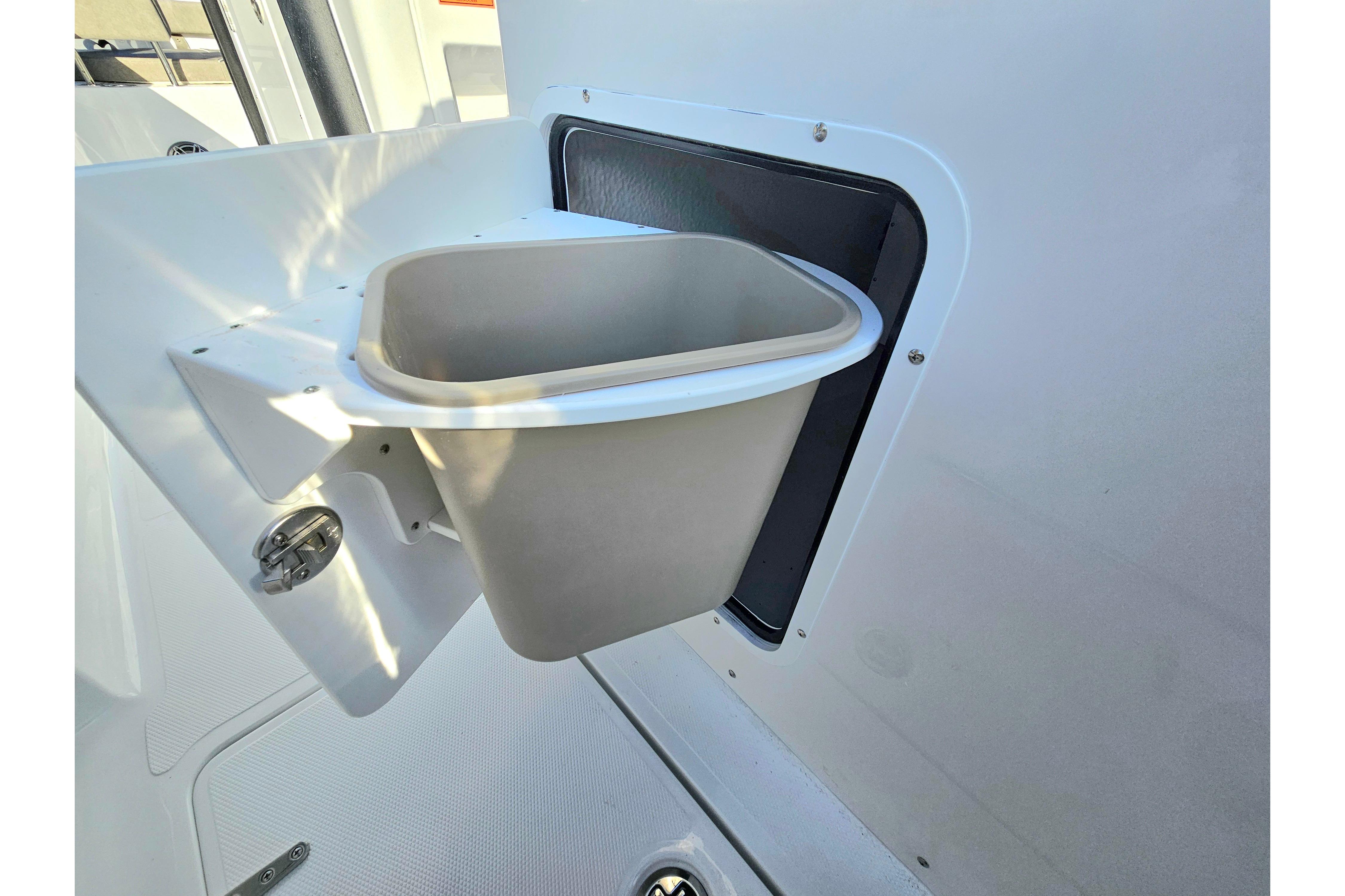 Trash bin on 2026 Sea Hunt Ultra 285 SE boat, integrated into the side panel.