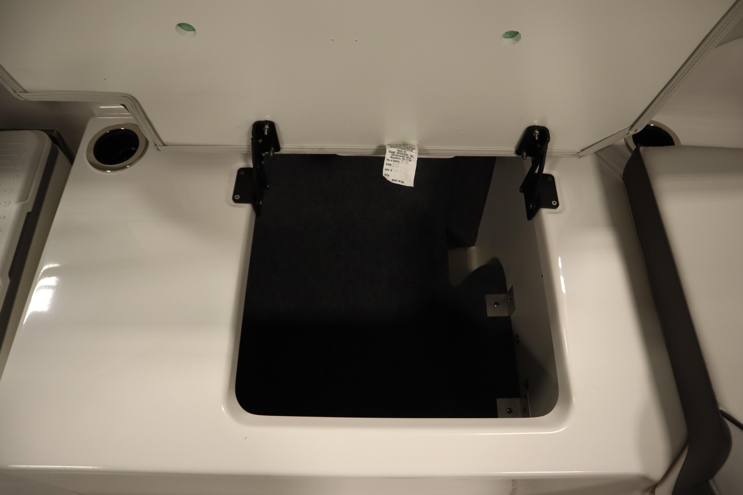 Open storage compartment on 2026 Yamaha Boats AR250.