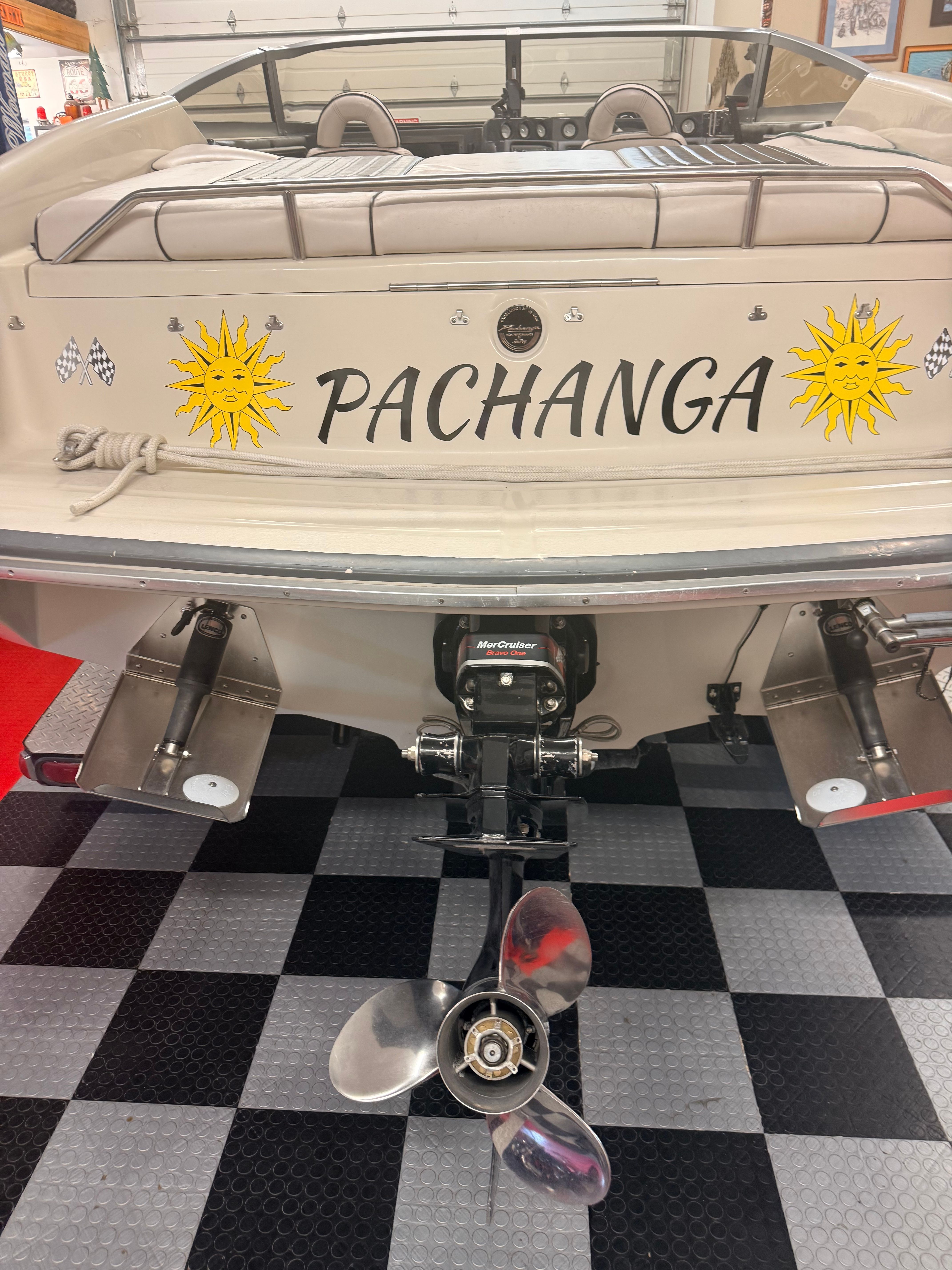 The image shows the stern of a 1986 Sea Ray Pachanga 11 boat with sun motifs.