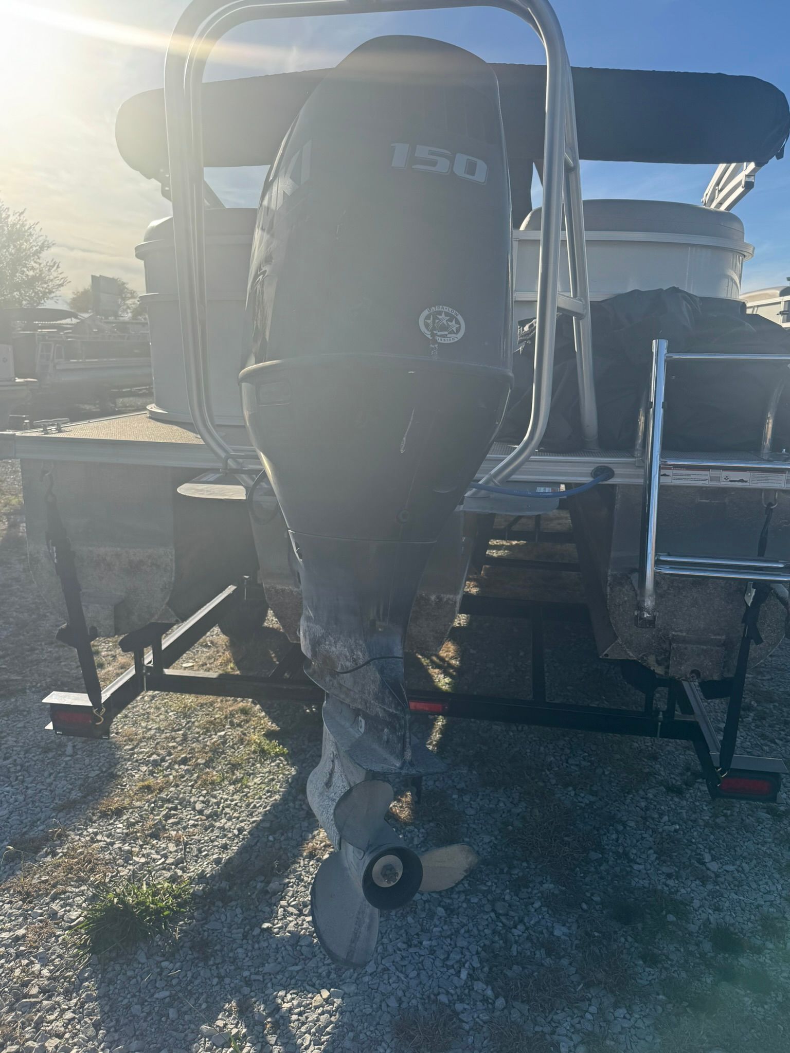 2024 Landau 252 Island Breeze outboard motor in sunlight.