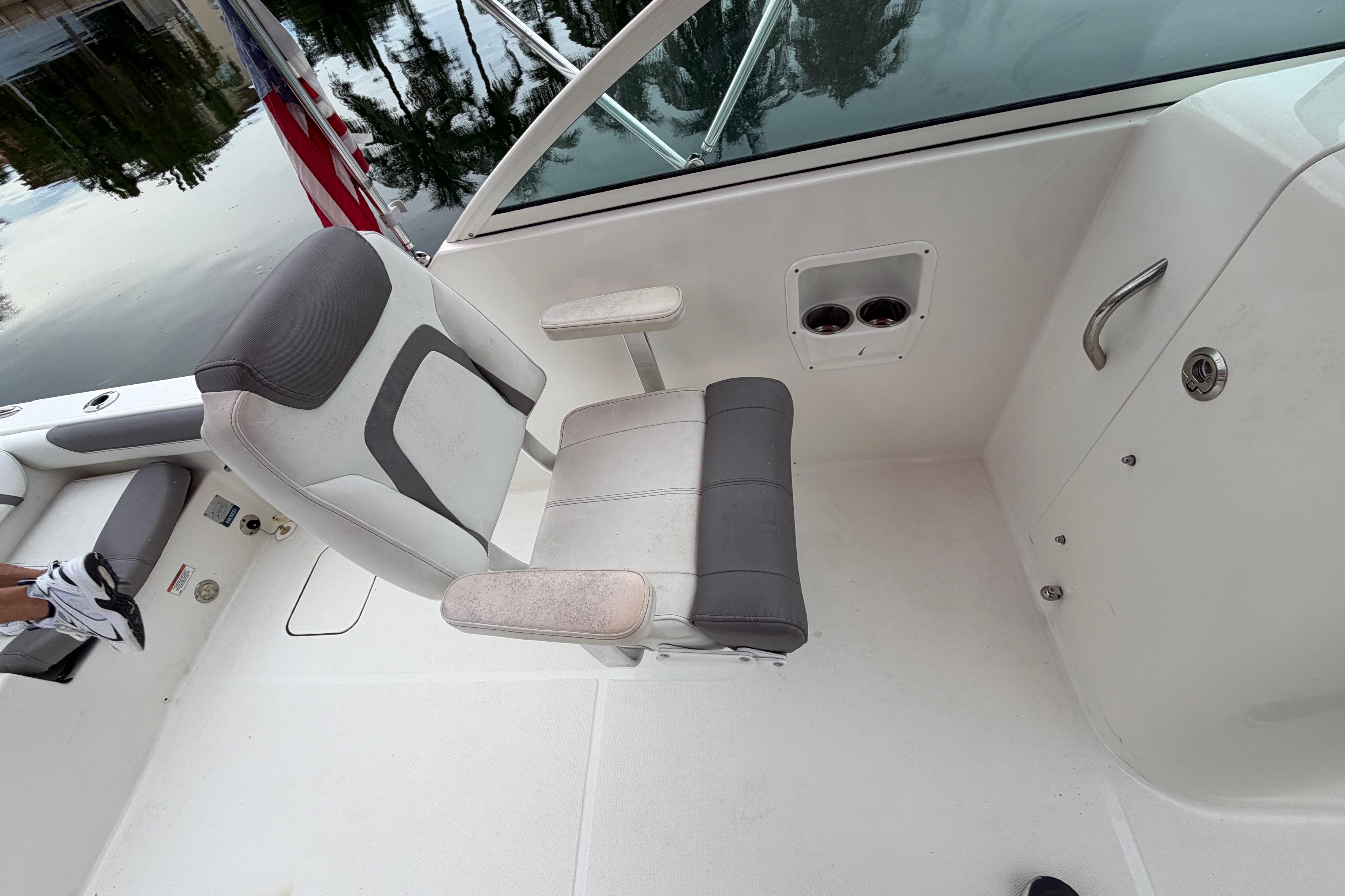 2019 World Cat 230 DC boat interior with seating and cup holders.