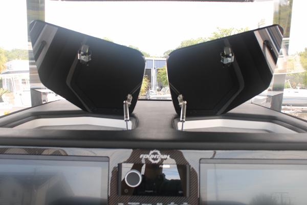 2024 Fountain 34 SC dashboard with open compartments and control panel.