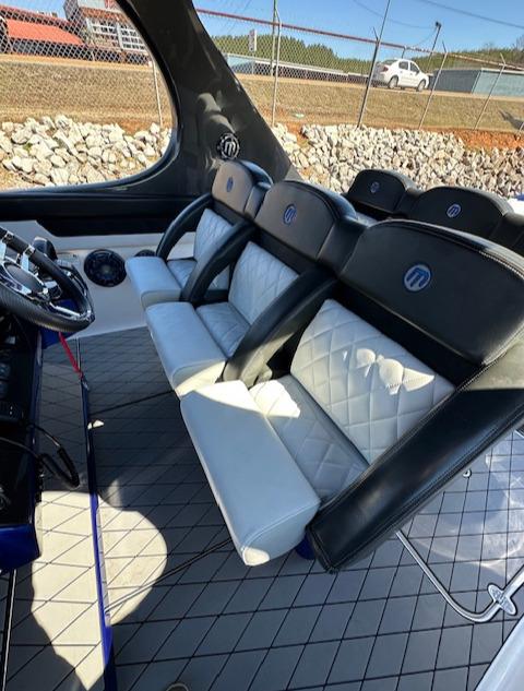 Interior seating of 2019 Mystic Powerboats M4200 with luxurious black and white design.