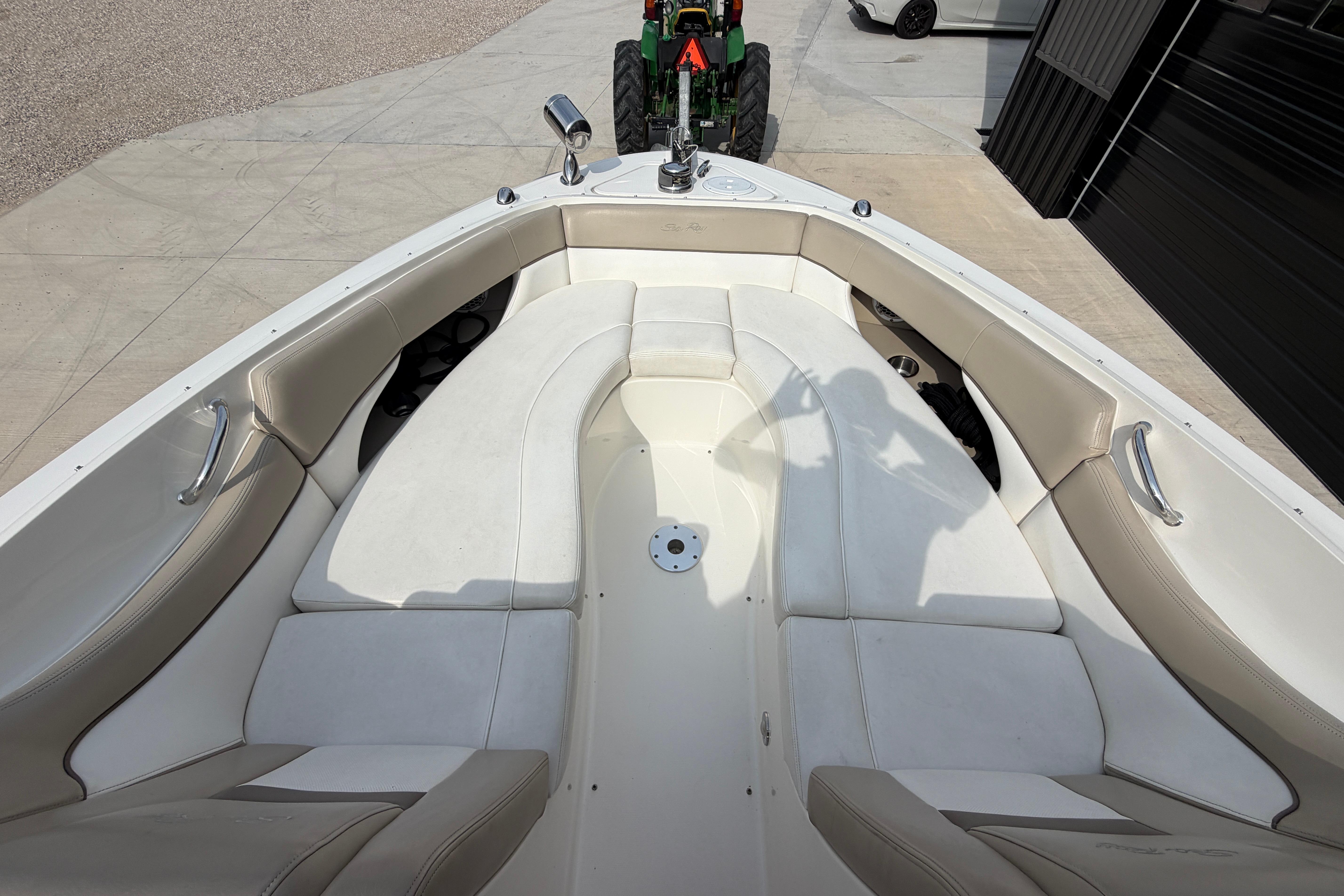 2013 Sea Ray 300 SLX boat interior with white seating and stainless steel handles.