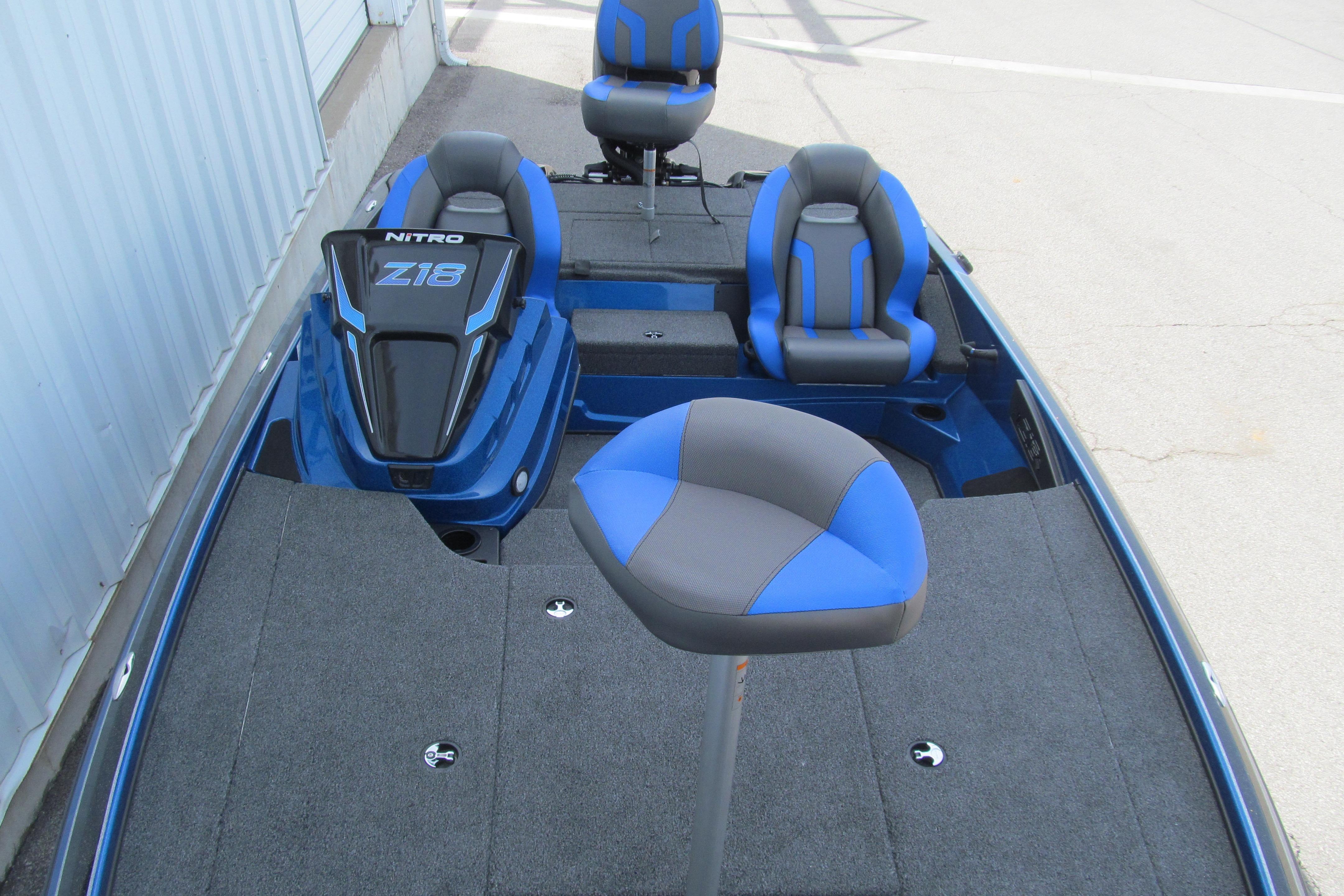 2026 Nitro Z18 Pro boat interior with blue and gray seating, showcasing spacious deck design.