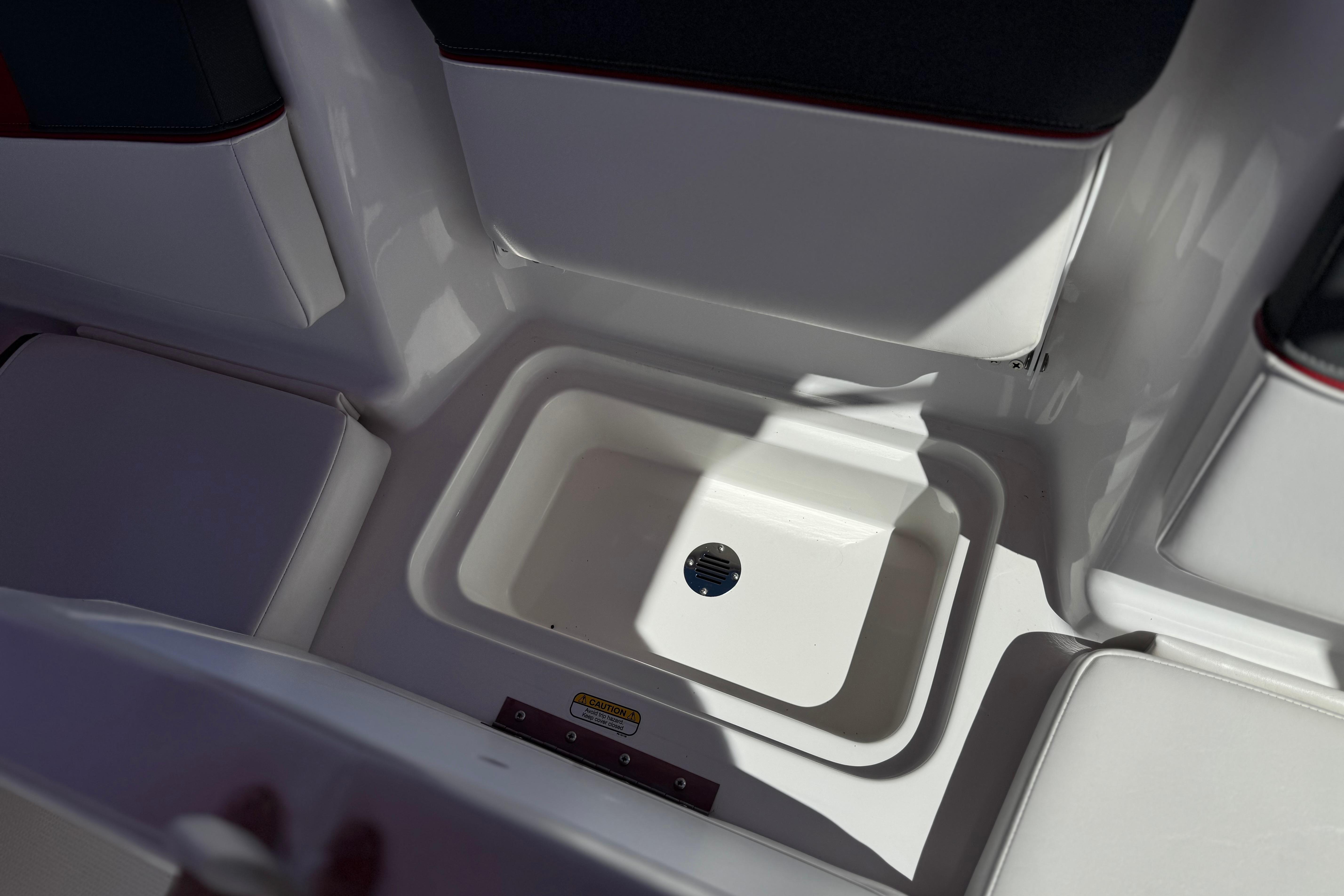 2024 Tahoe T16 boat interior with built-in storage compartment.
