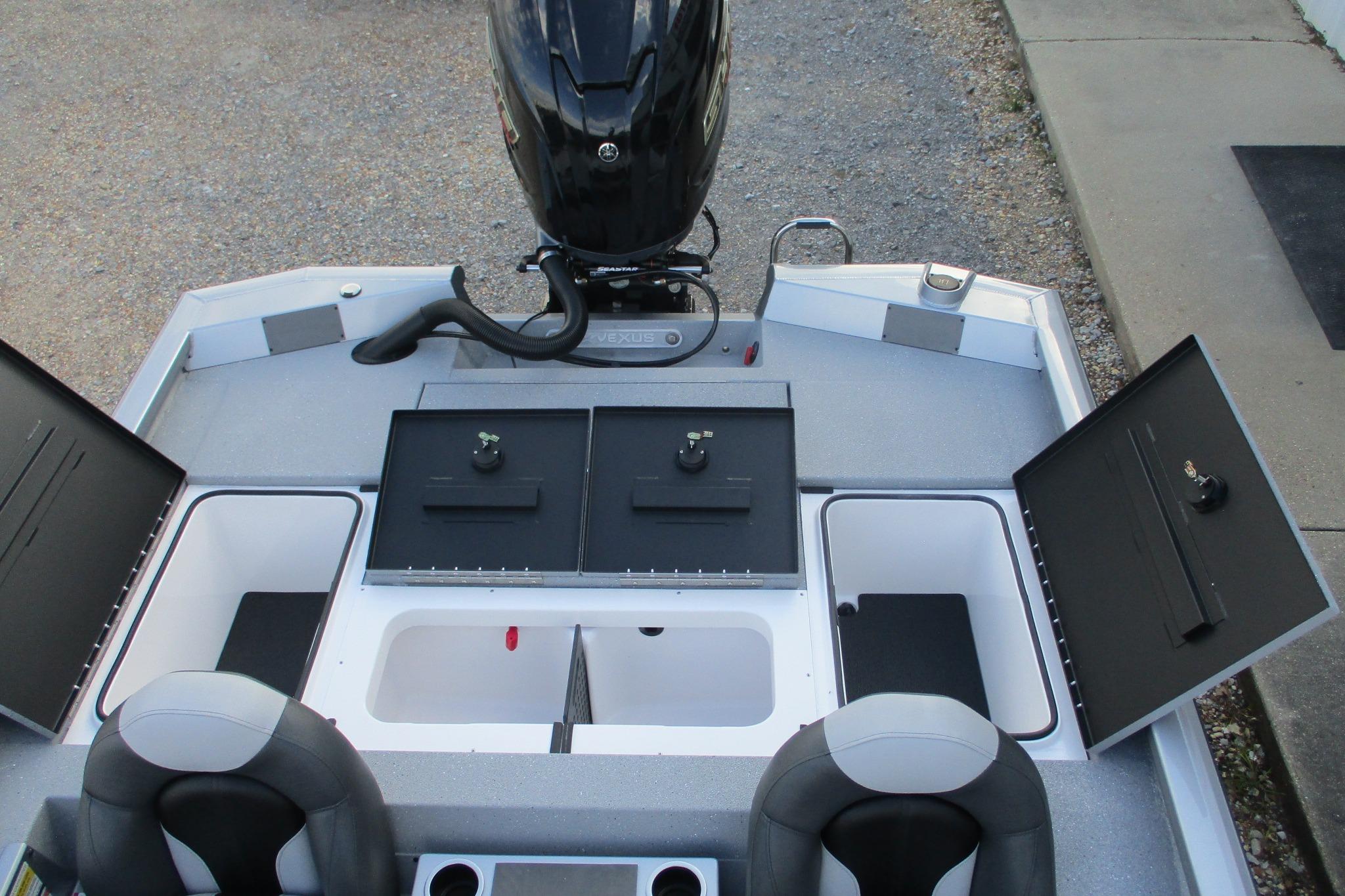 2026 Vexus AVX2080 boat interior with storage compartments and seating.