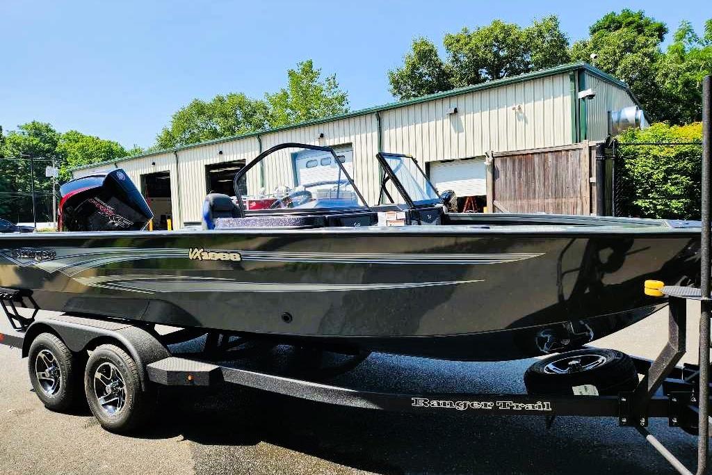 2026 Ranger VX1988 WT boat on trailer, parked outdoors near a building.