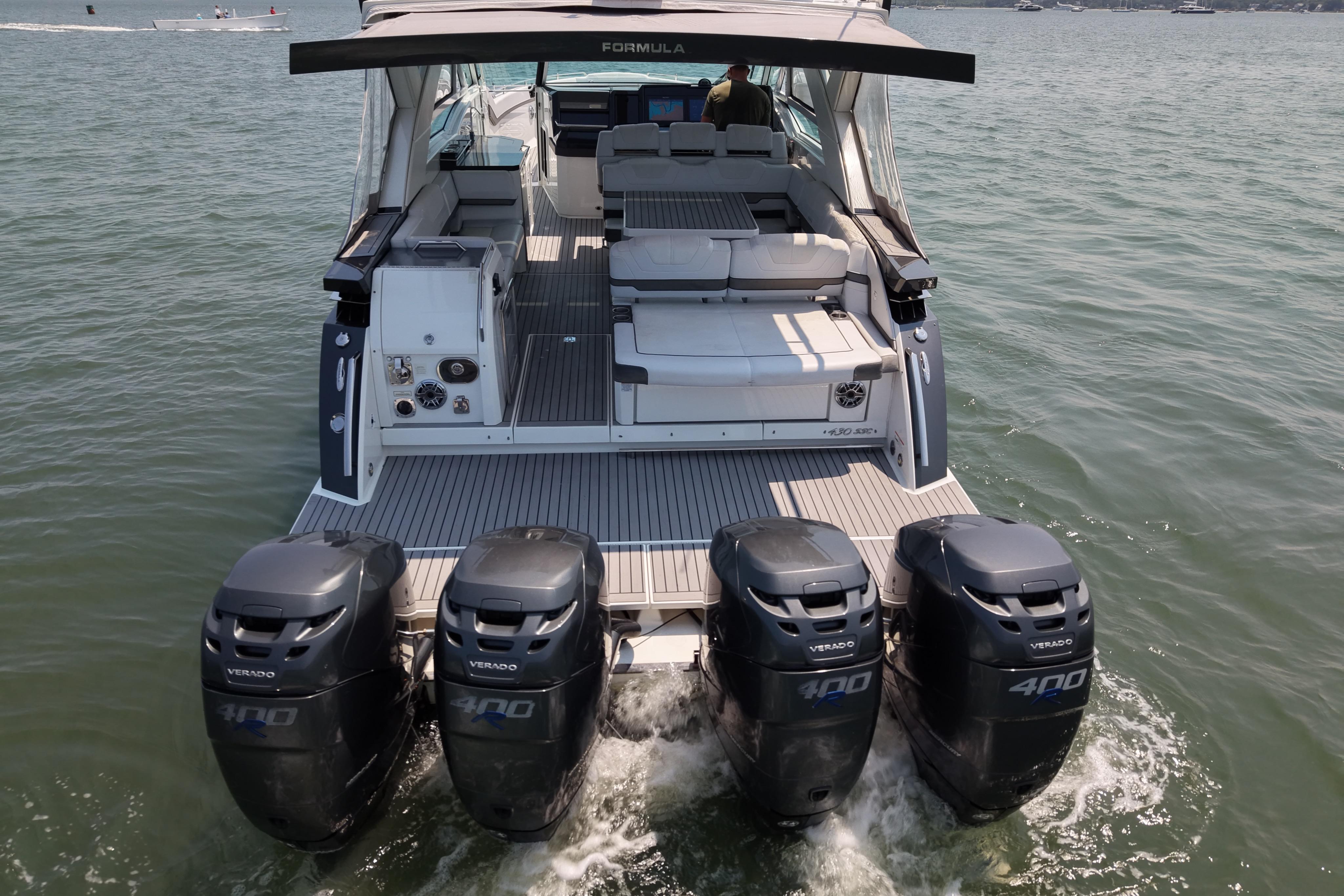 2019 Formula 430 Super Sport Crossover with four powerful outboard engines on water.