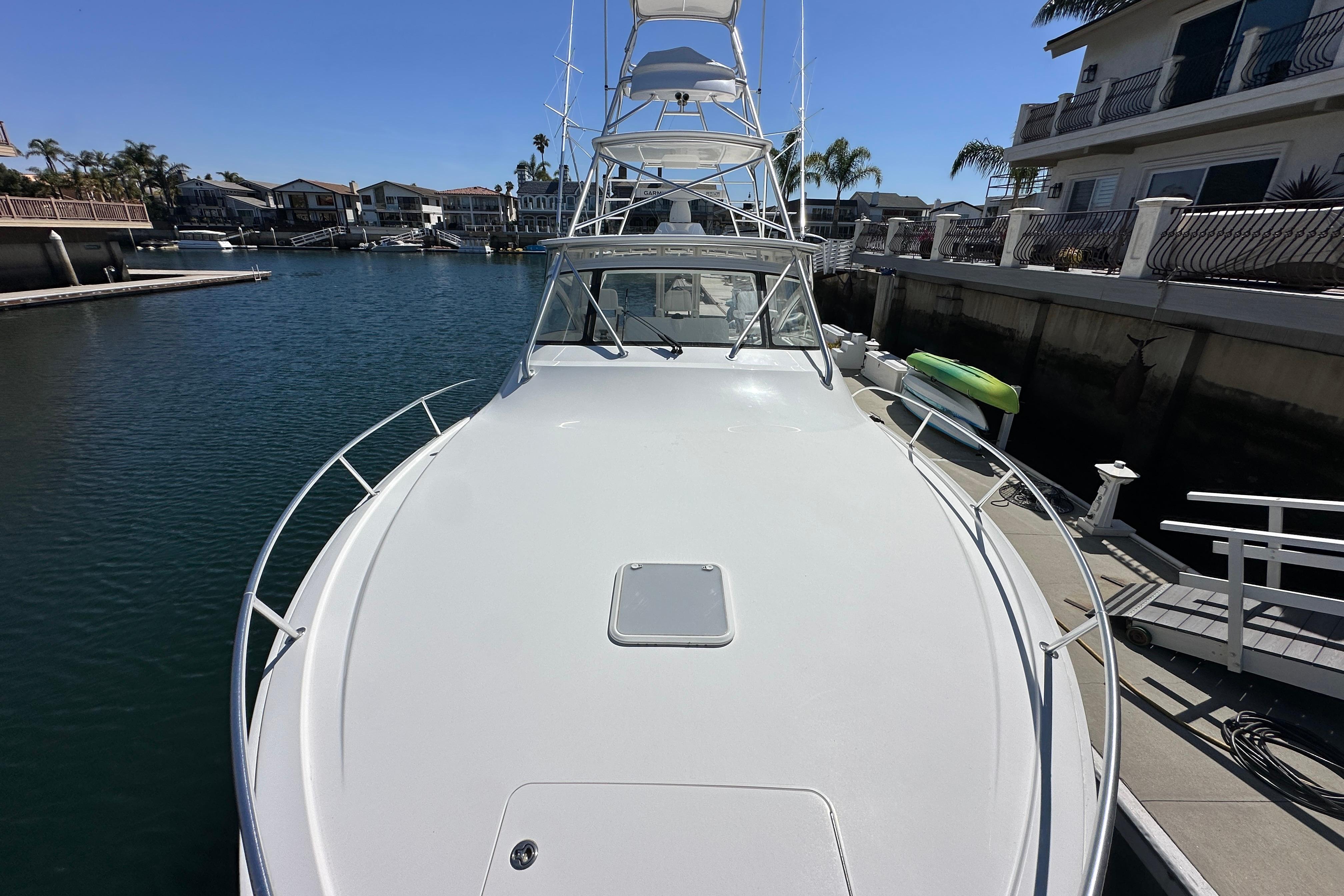 2012 Viking 42 Open yacht docked in a serene marina setting.