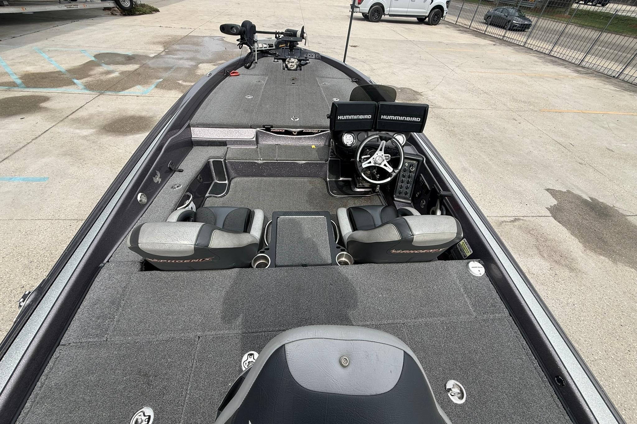 2018 Phoenix 919 ProXP fishing boat interior with dual Humminbird displays and seating.