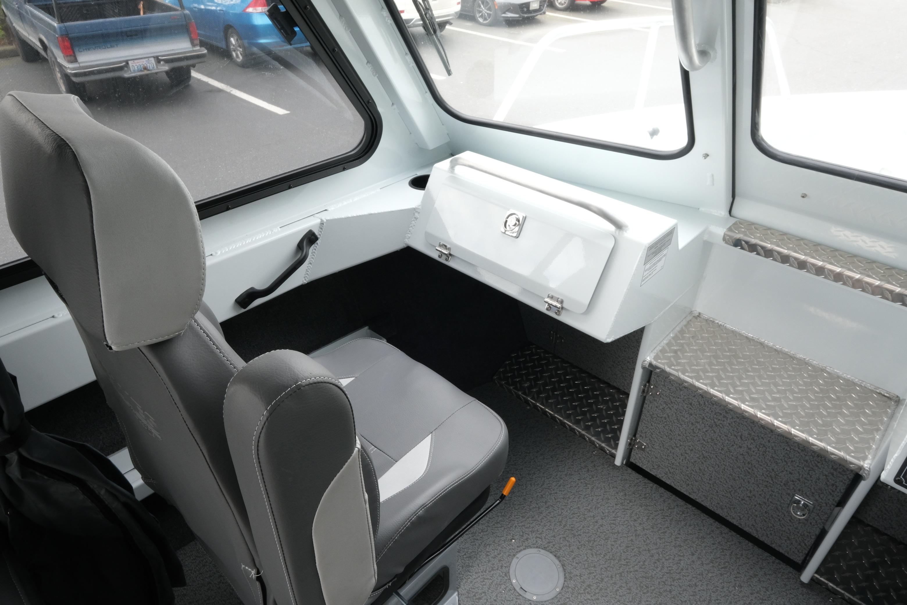 2026 Hewescraft 210 Sea Runner ET Hardtop interior with seating and storage compartments.
