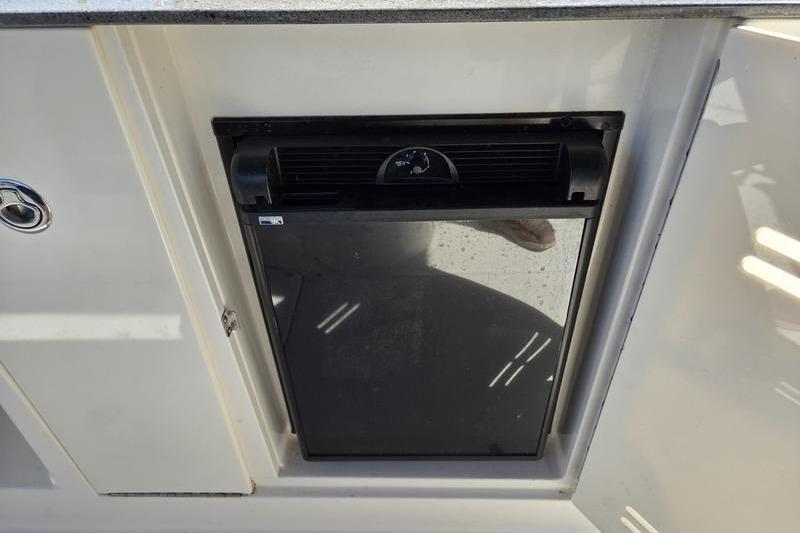 Built-in refrigerator on 2011 Sea Ray 300 Sundeck boat.