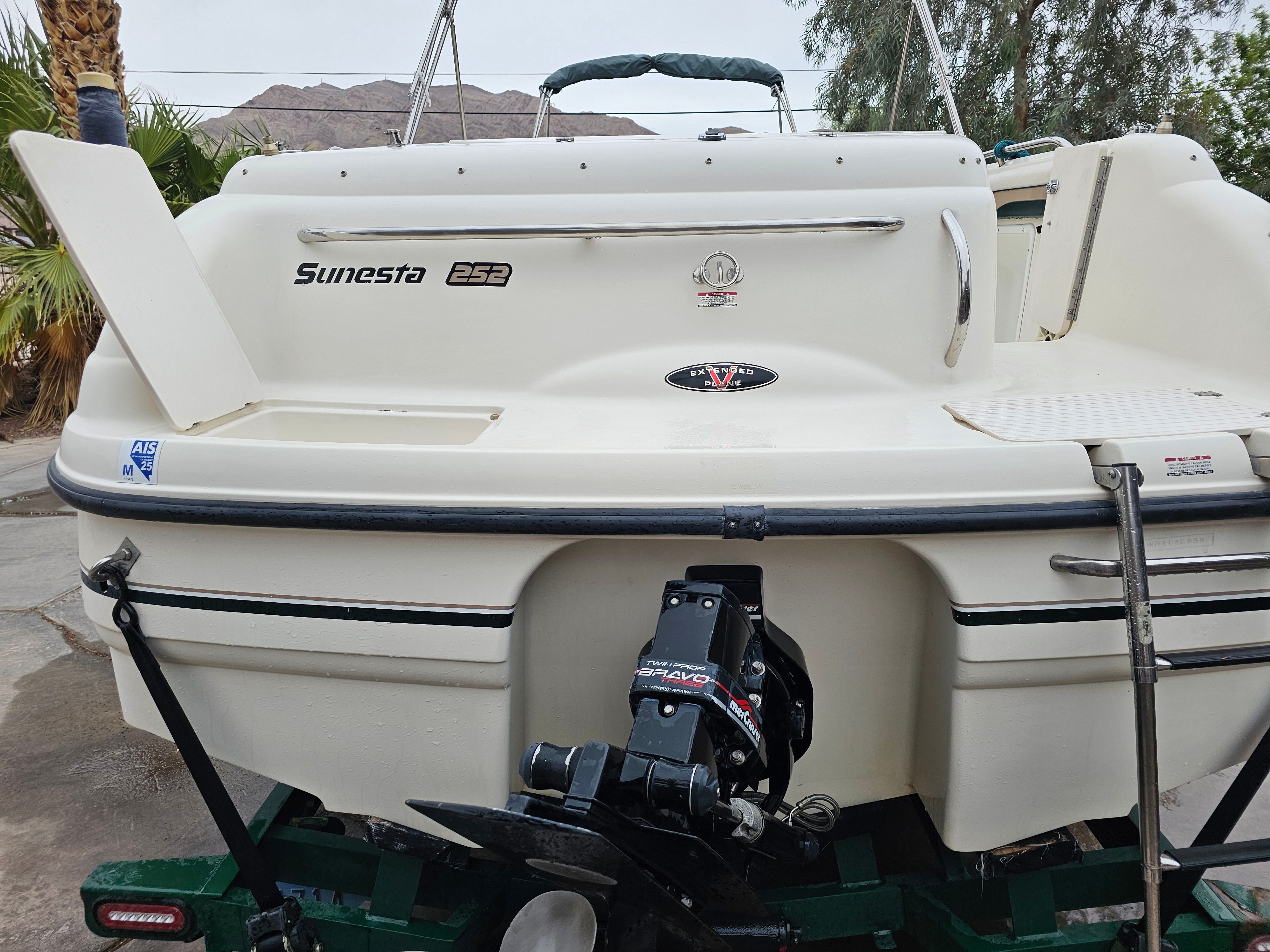 1998 Chaparral Sunesta 252 Special Edition boat at dock.