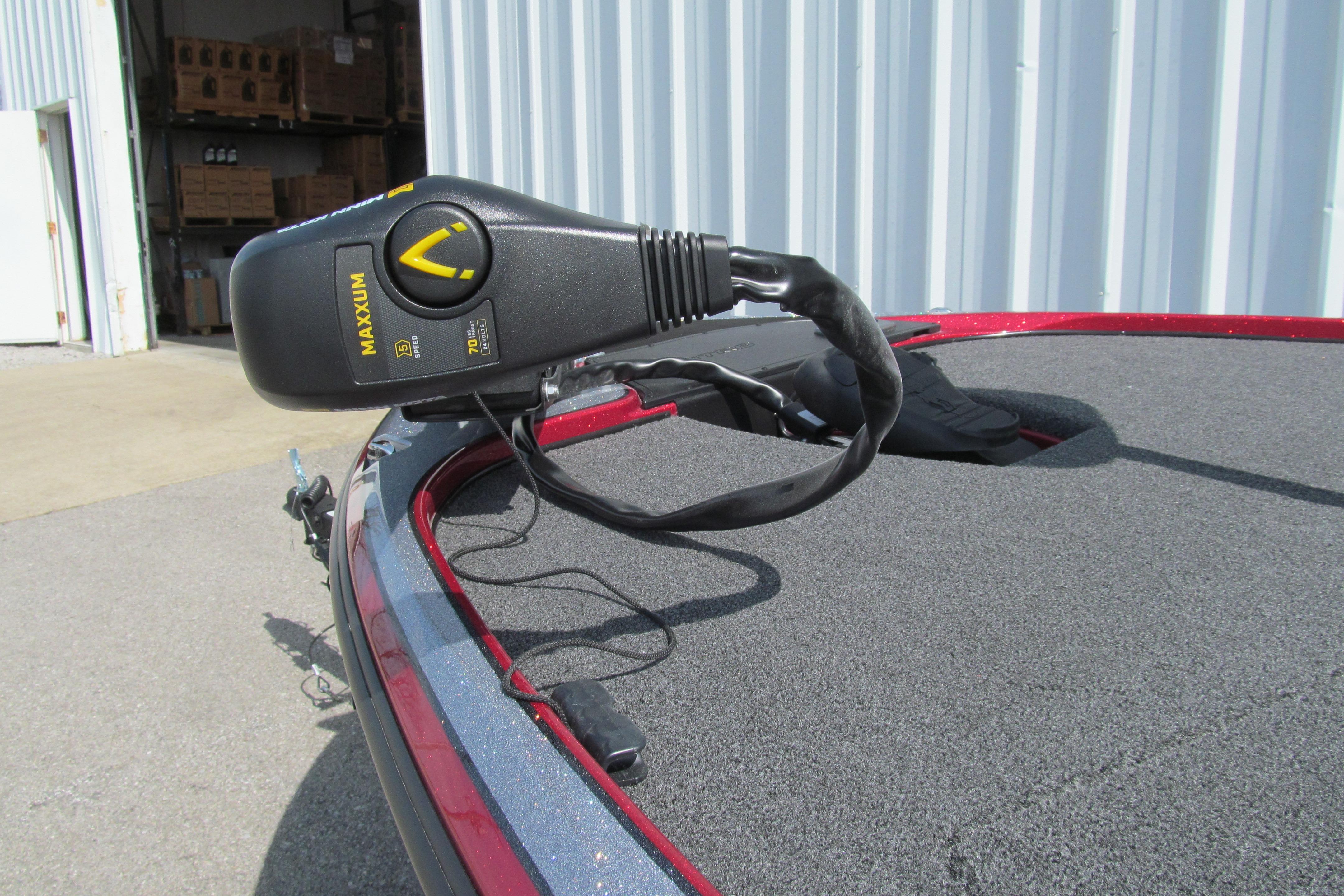 Trolling motor on a 2026 Nitro Z17 boat, parked near a warehouse.