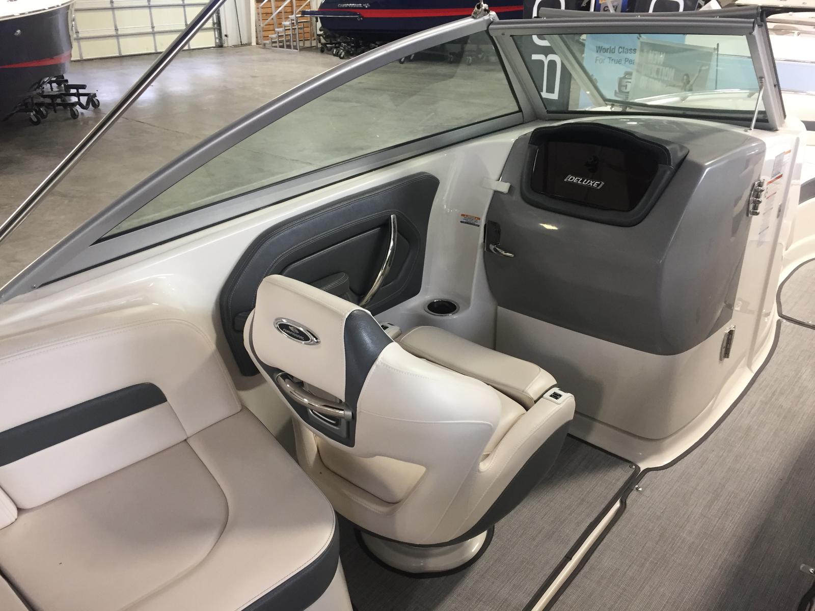 Interior of a 2019 Chaparral 264 Sunesta boat with seating area.