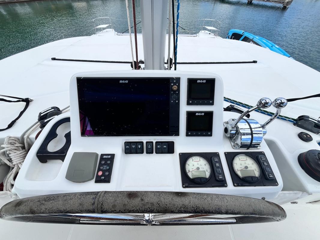 Helm station of 2019 Lagoon 50 catamaran with navigation instruments and controls.