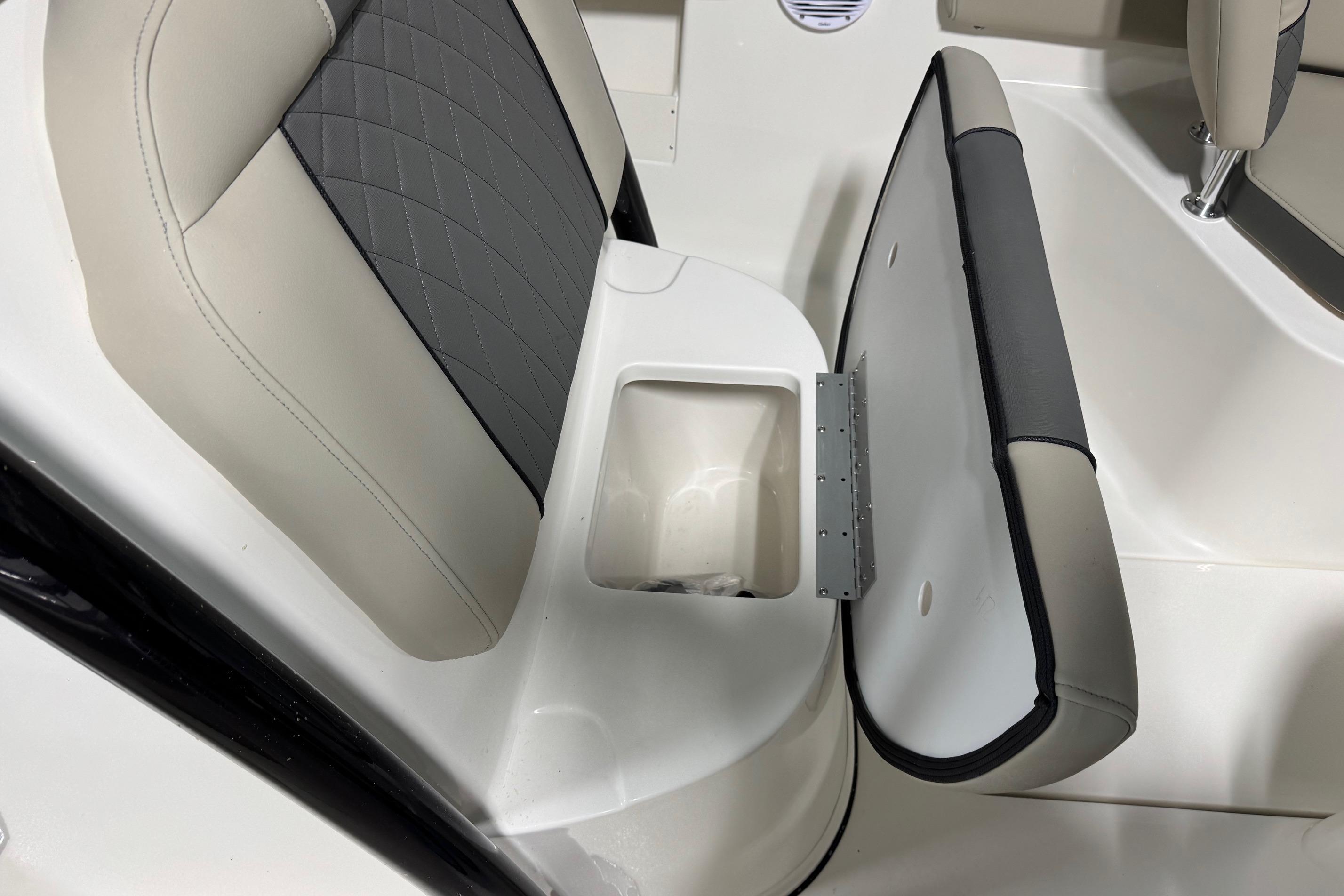 2026 Key West 239 FS boat seat with open storage compartment.