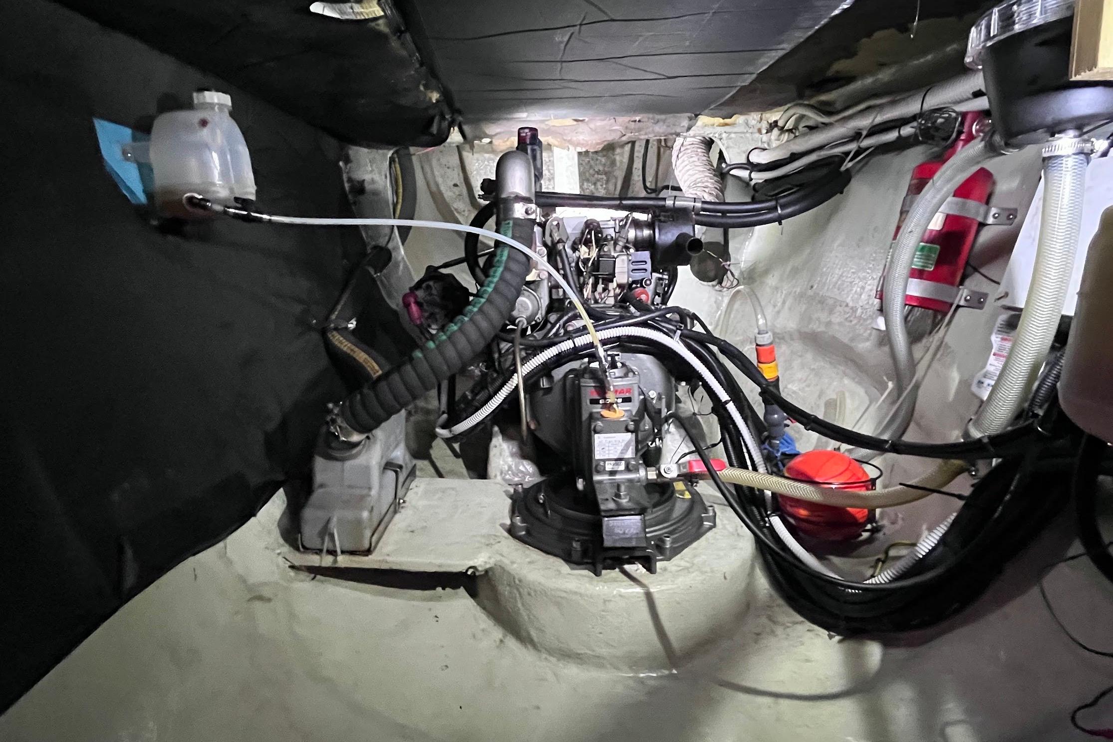 Engine room of a 2006 Maxim Yachts 380 MK2 Catamaran, showcasing mechanical components and wiring.