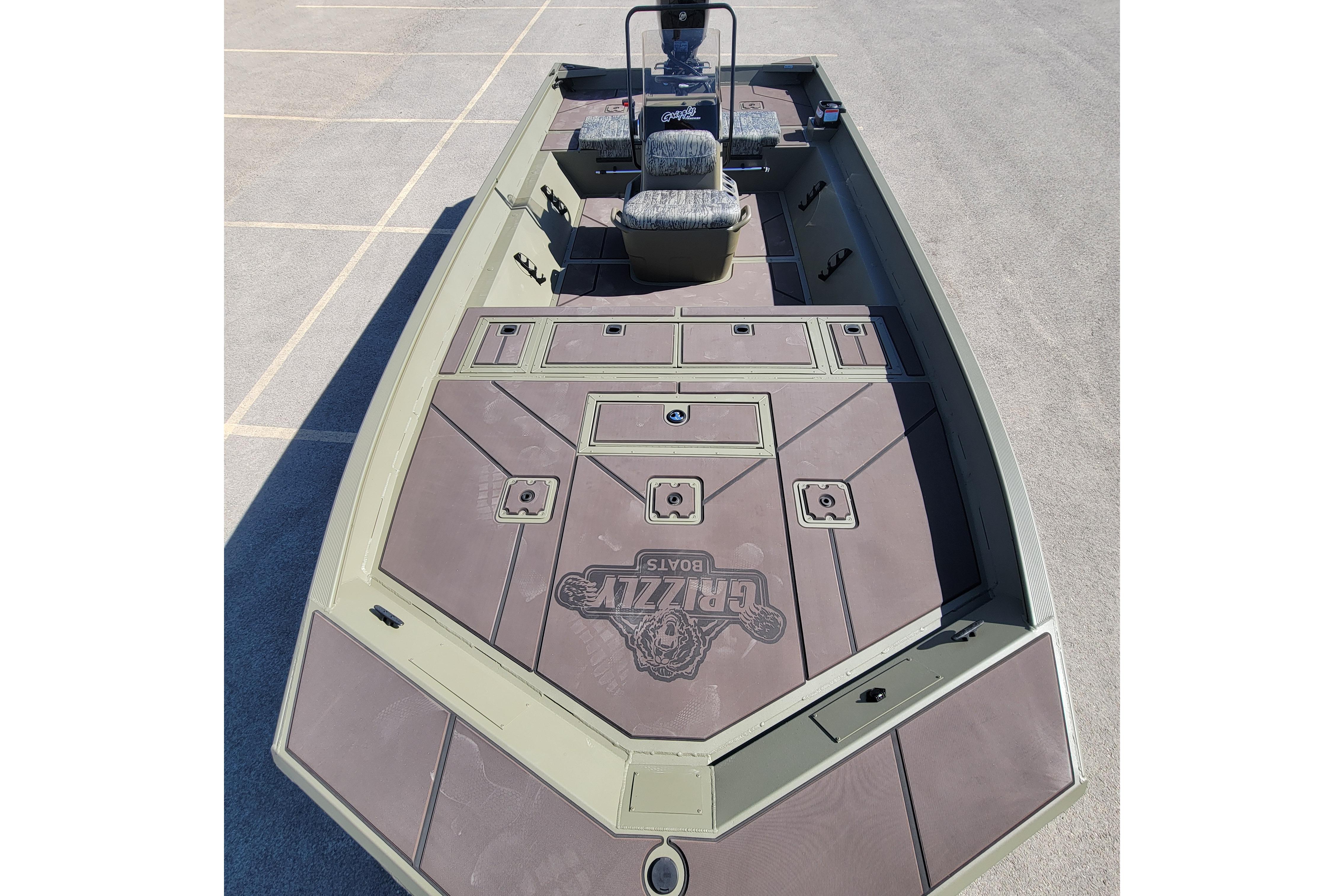 2026 Tracker Grizzly 2072 CC boat with spacious deck and seating.