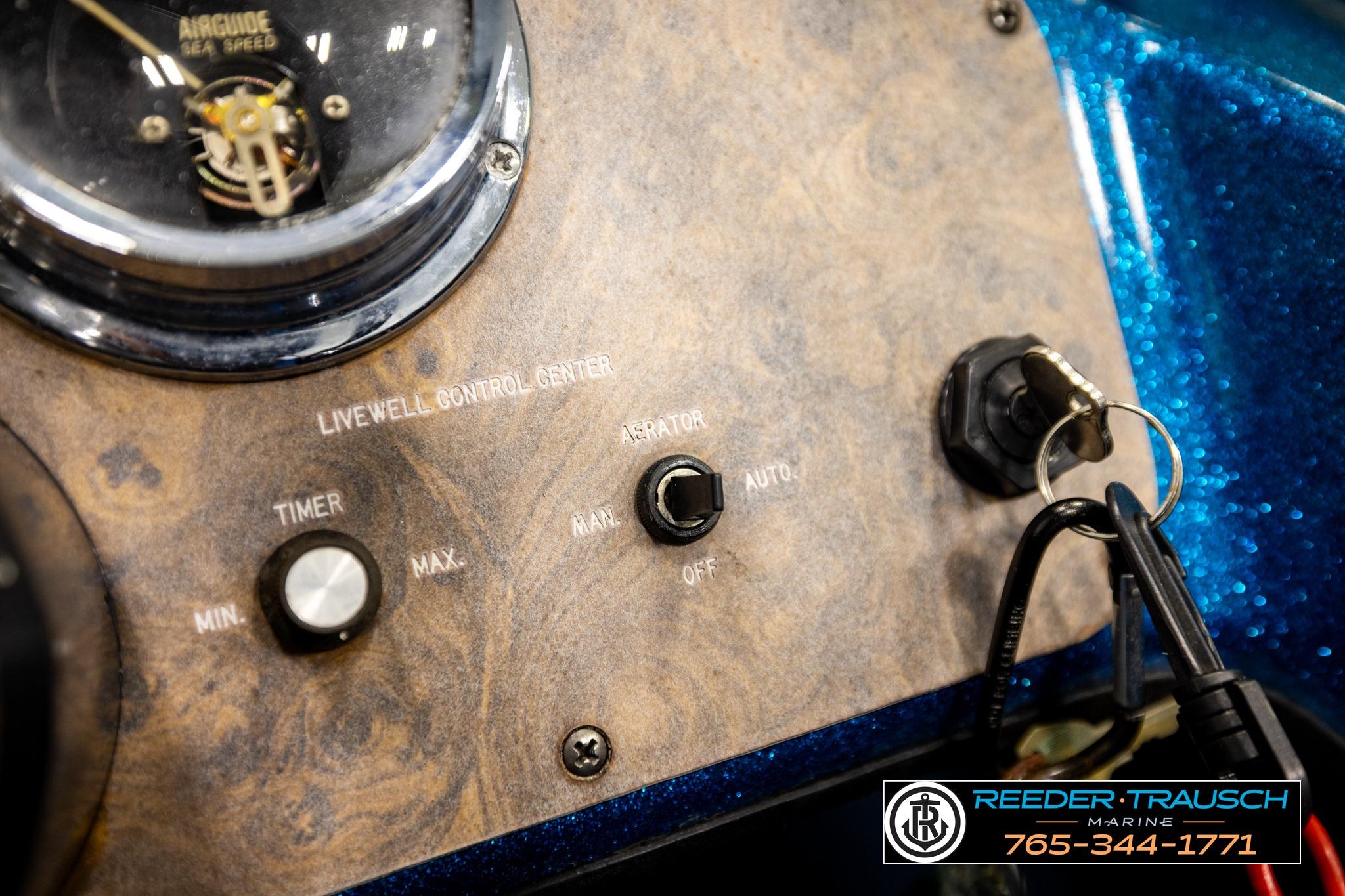 Control panel of a 1980 Ranger 175 VS boat with keys and switches.
