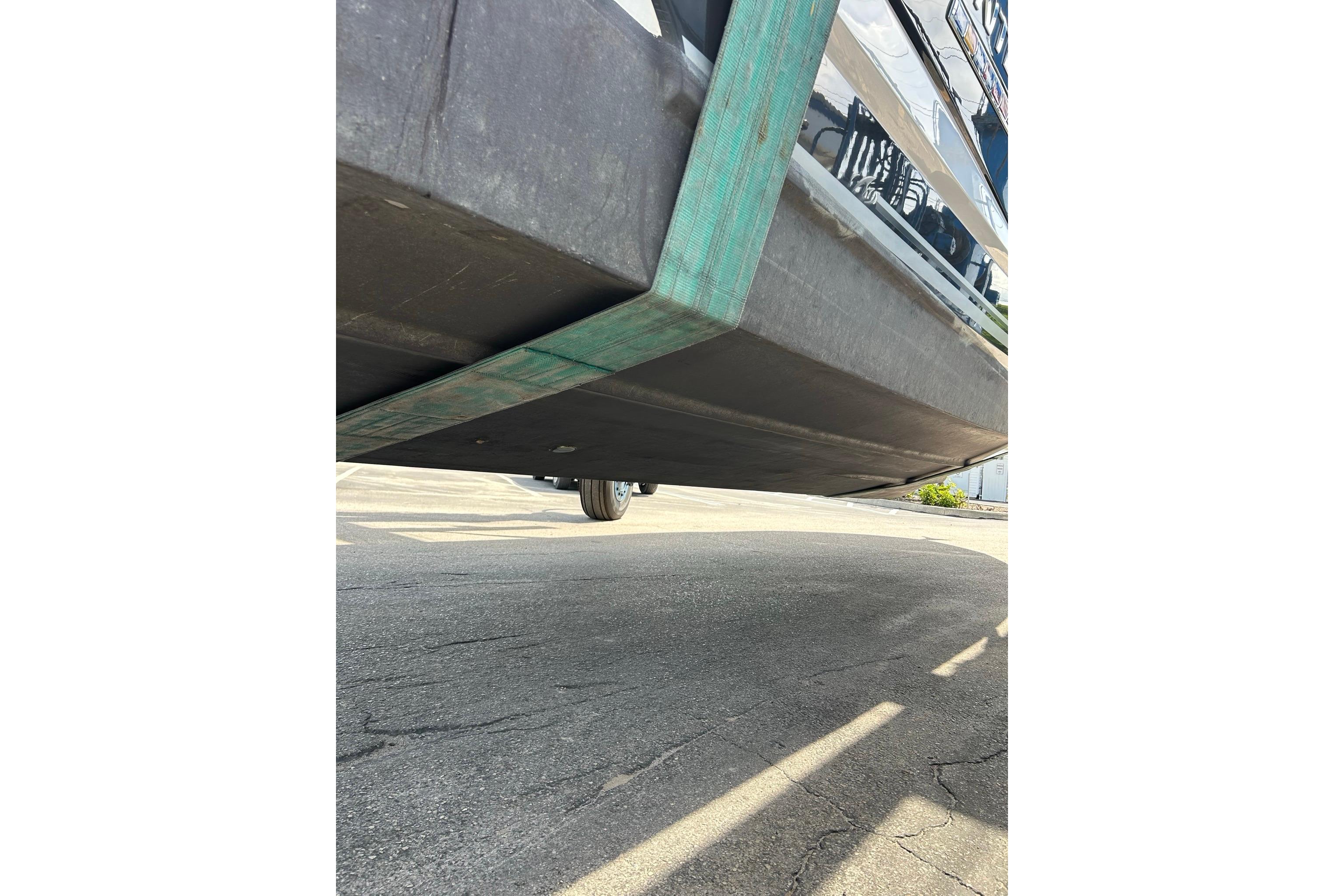 2019 Monterey 335 Sport Yacht hull view on trailer, showcasing underside details.