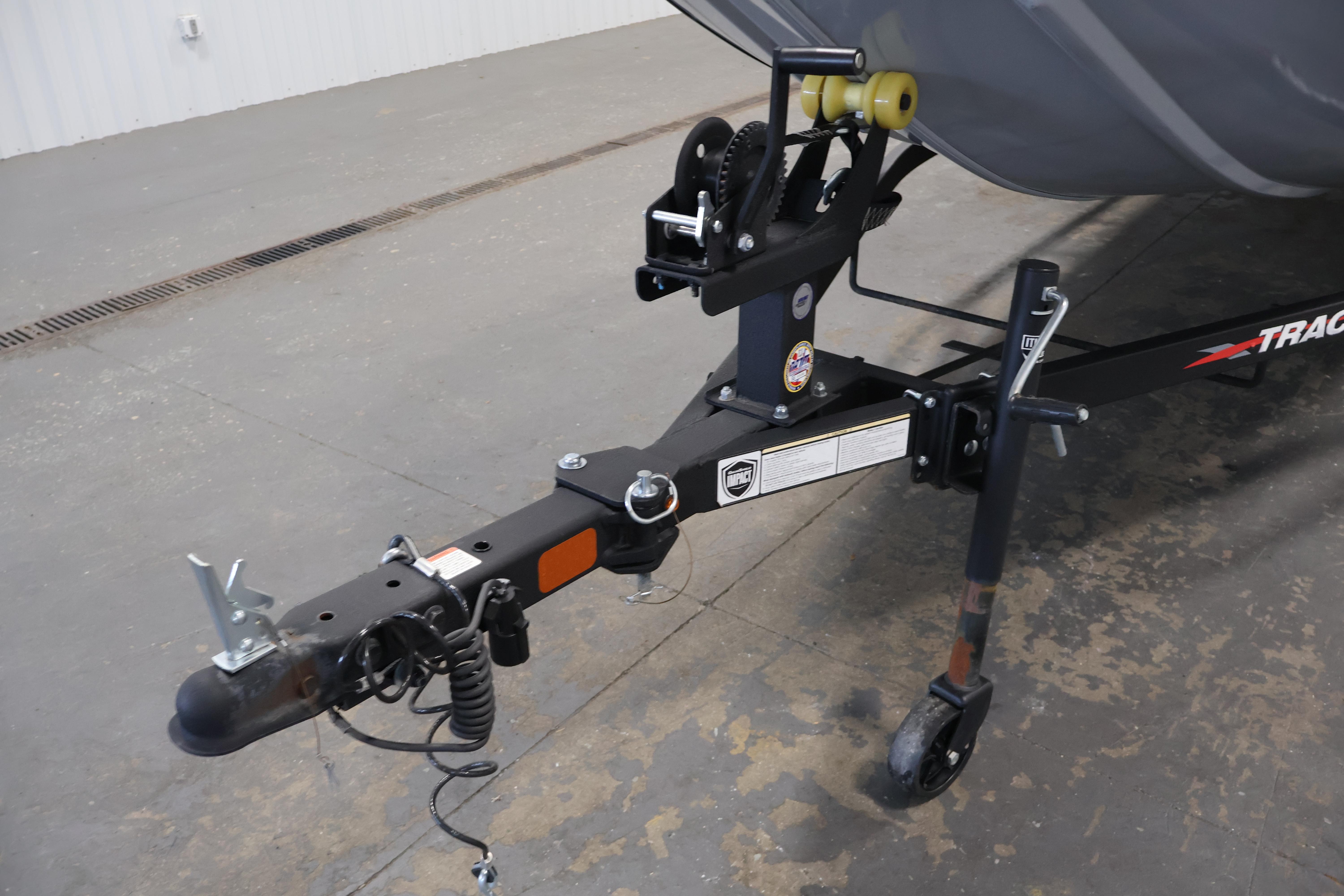 2024 Tracker Pro 170 boat trailer hitch and winch system in a garage setting.