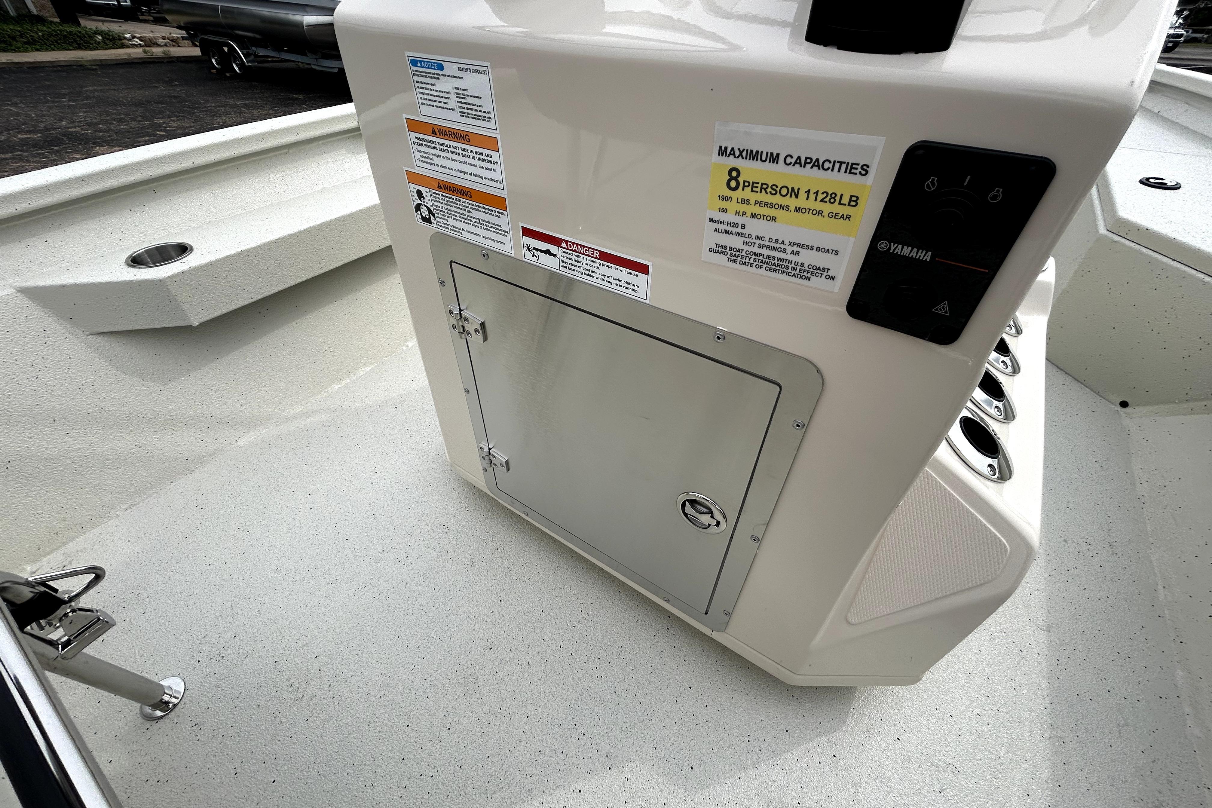 2026 Xpress H20B Bay boat console with capacity labels and storage compartment.