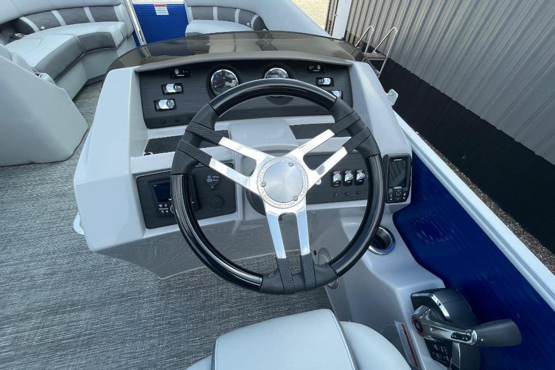 2024 Bennington 23 LSB boat dashboard with steering wheel and controls.
