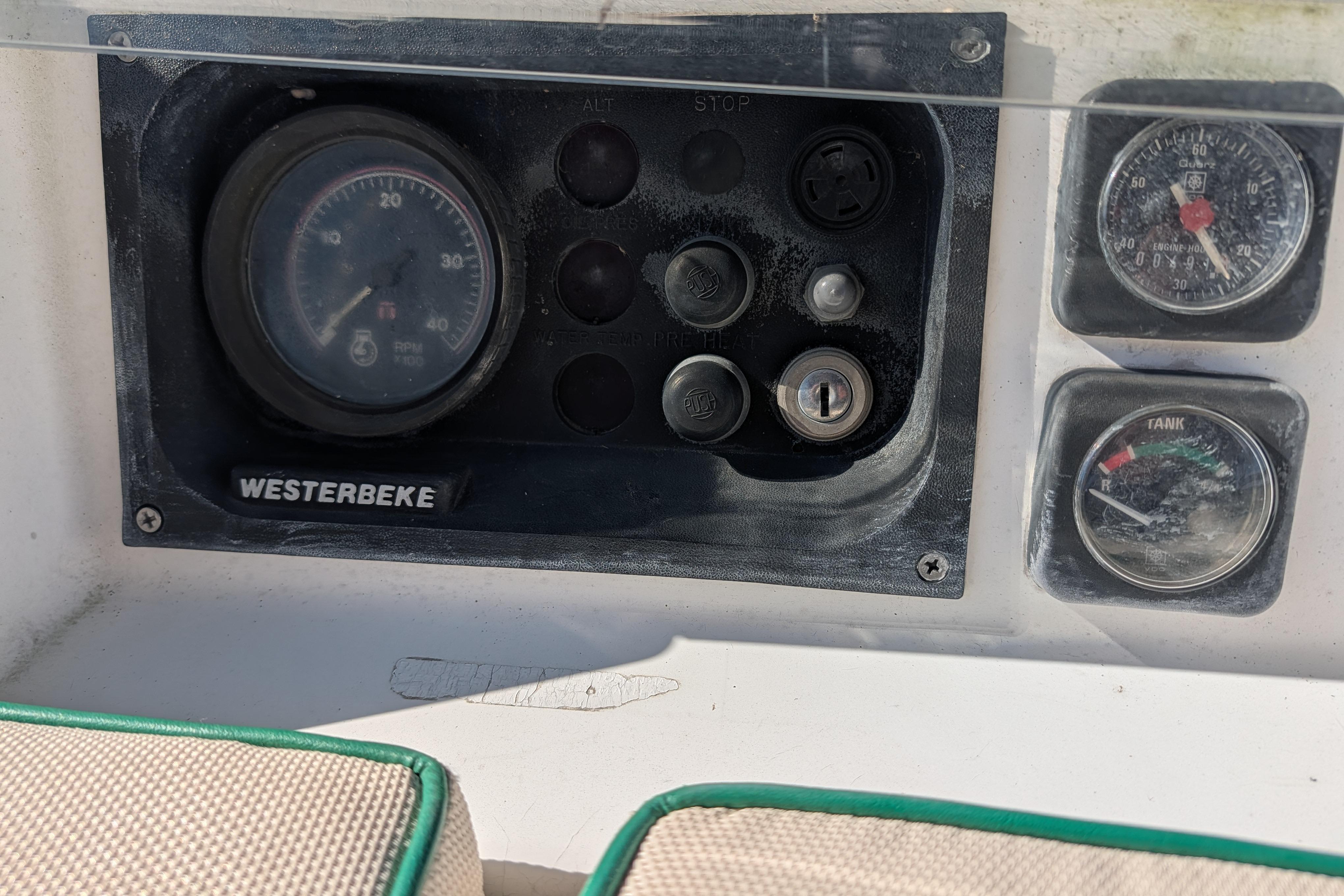 Control panel of a 2001 Beneteau Oceanis 331 sailboat with Westerbeke engine gauges.