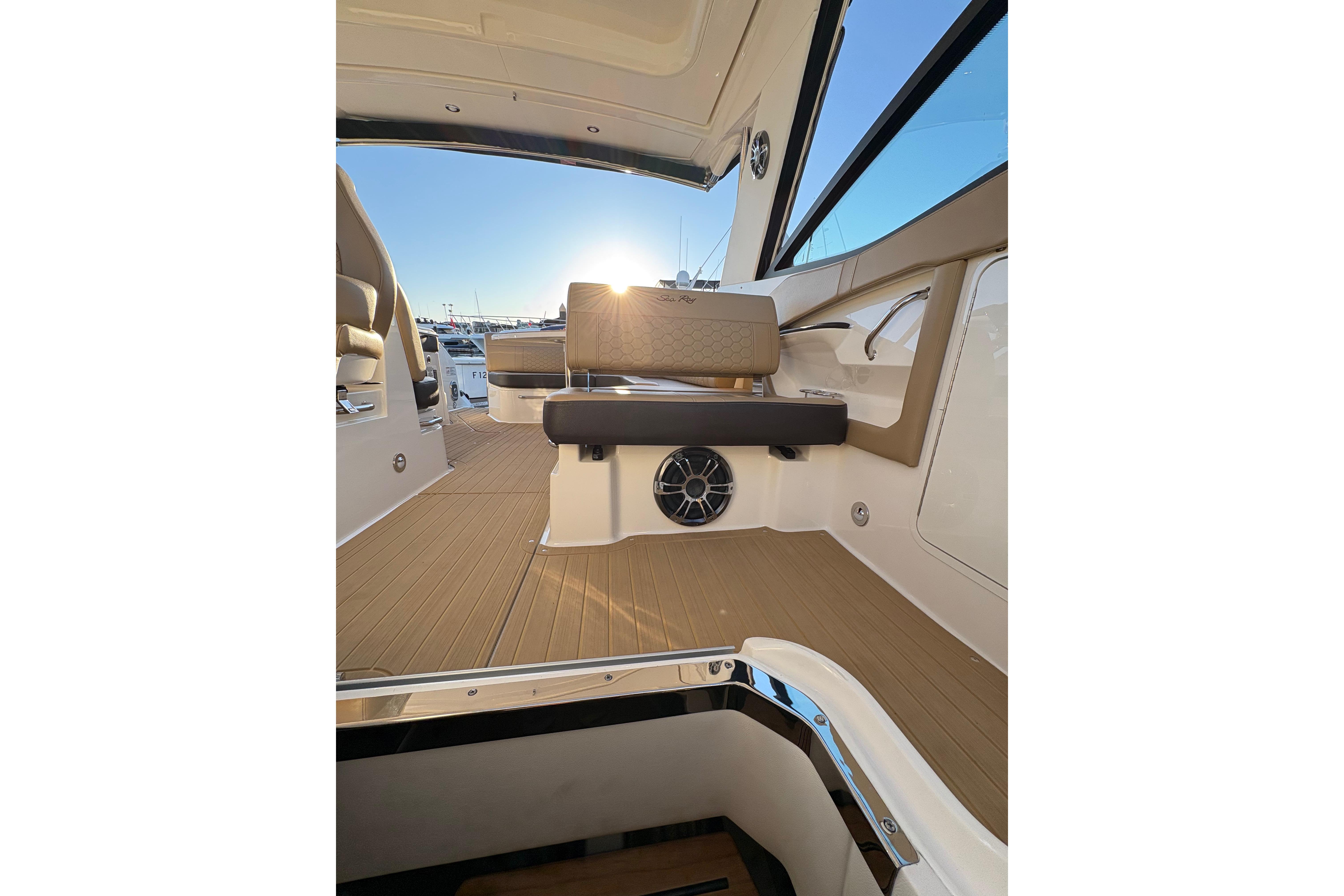 2022 Sea Ray Sundancer 320 interior with sunlit seating and sleek design.