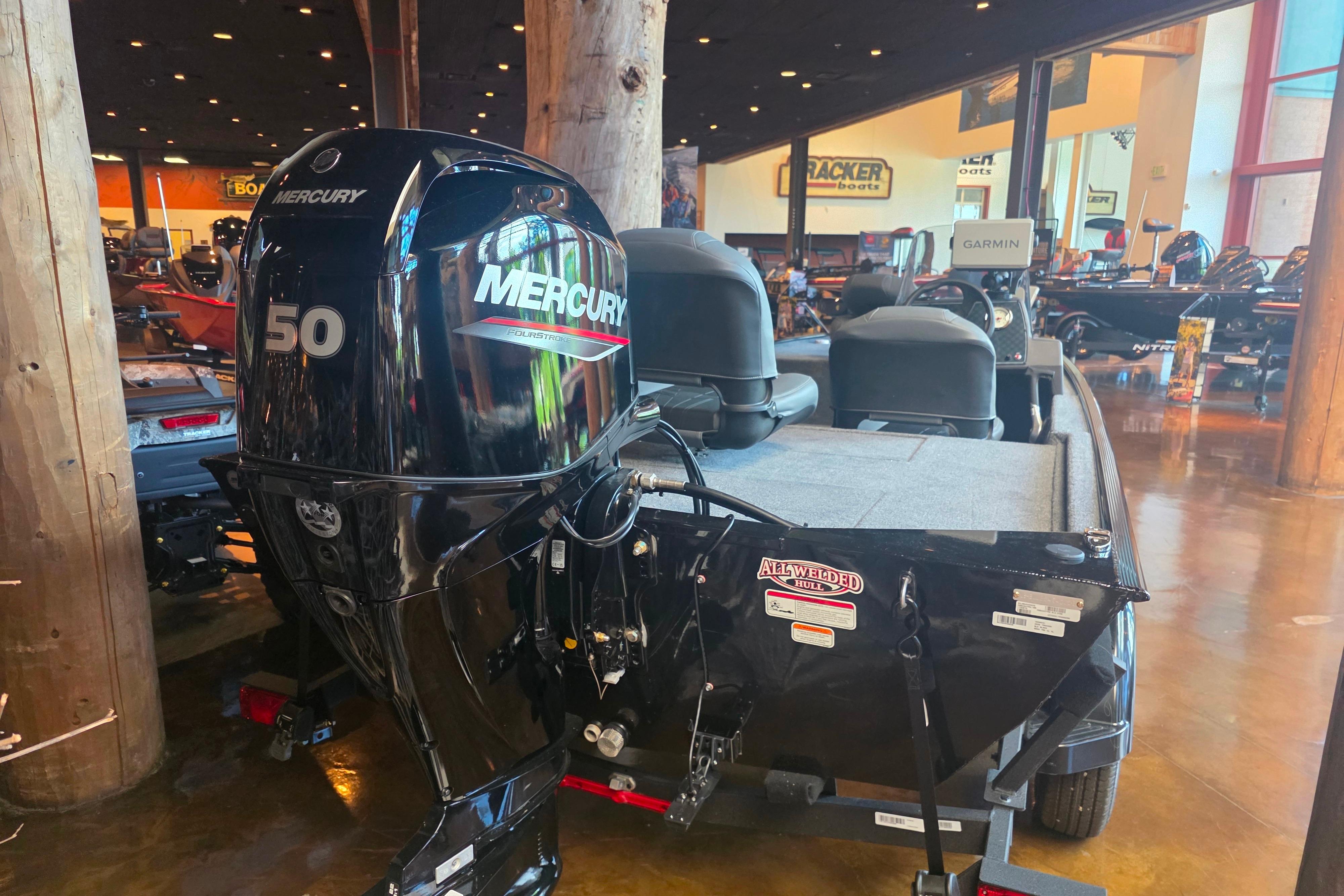 2026 Tracker Bass Tracker Classic XL with Mercury 50 engine displayed indoors.