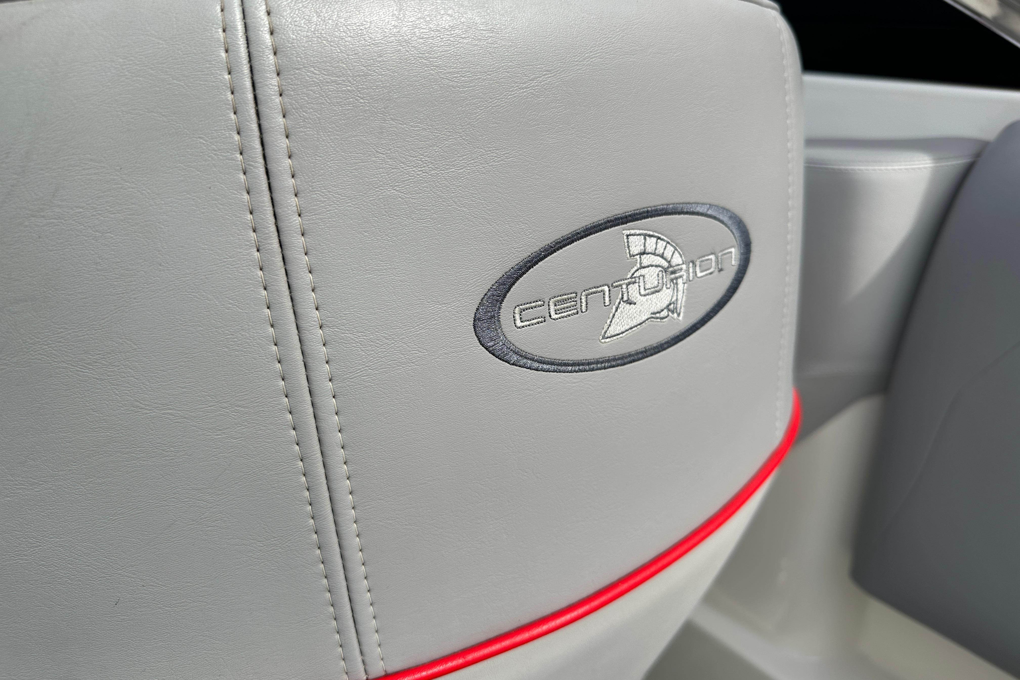Gray leather seat with Centurion logo, red accent, from 2008 Enzo SV240 boat.