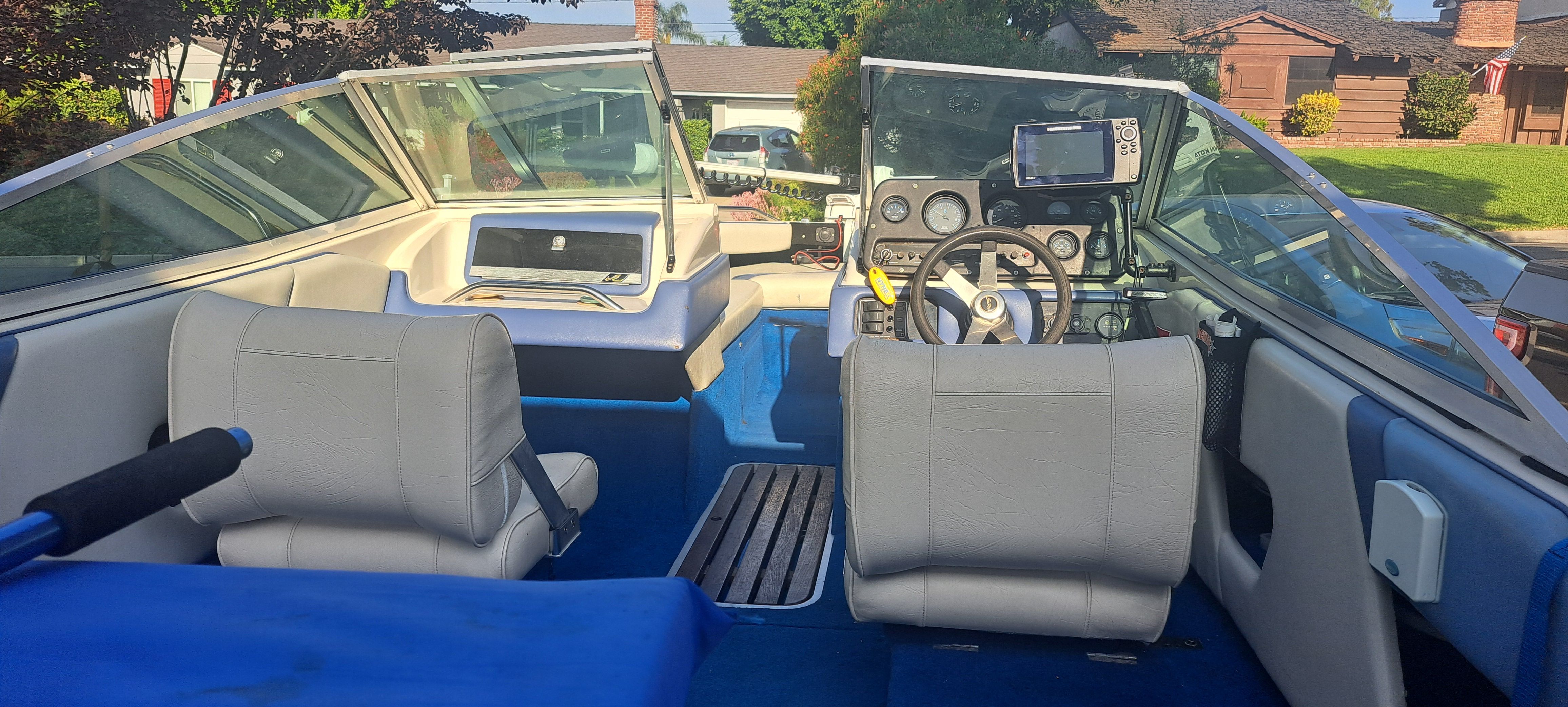 Interior view of a 1988 Sea Ray Seville boat with steering console.