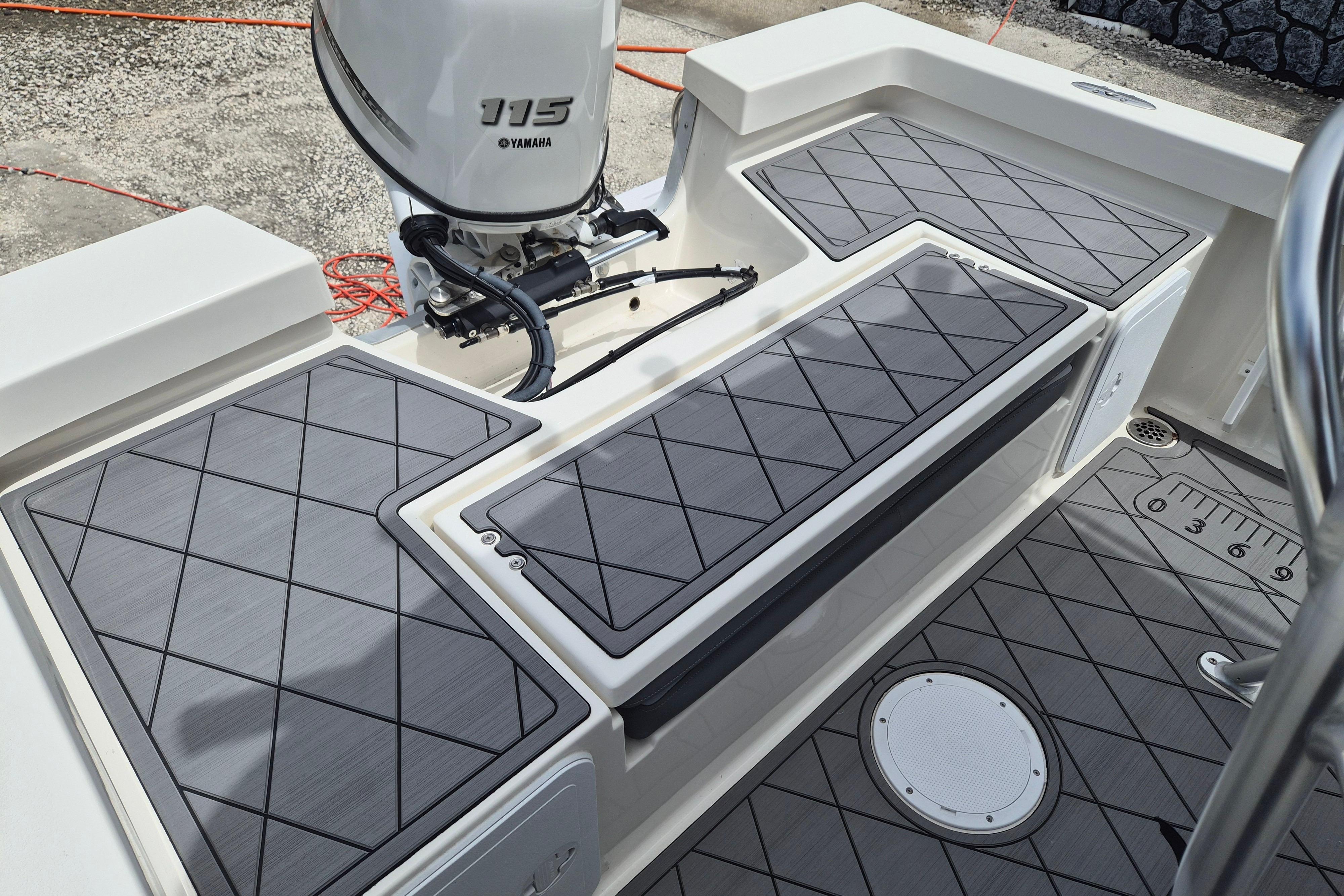 2026 Defiance Catalina 190 boat deck with Yamaha 115 engine, featuring non-slip flooring.
