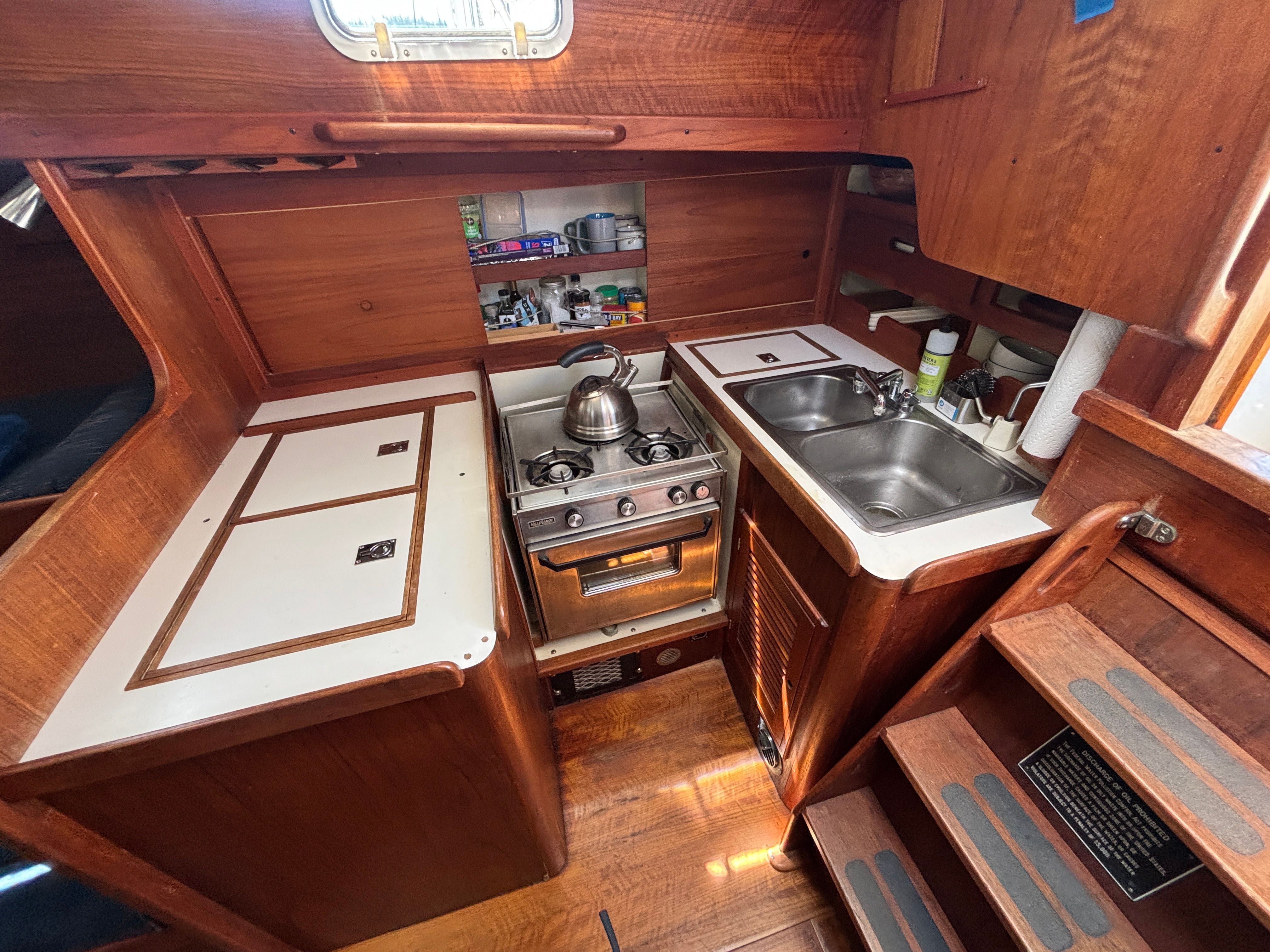 Interior view of a 1979 Tartan 37 featuring a well-equipped galley.