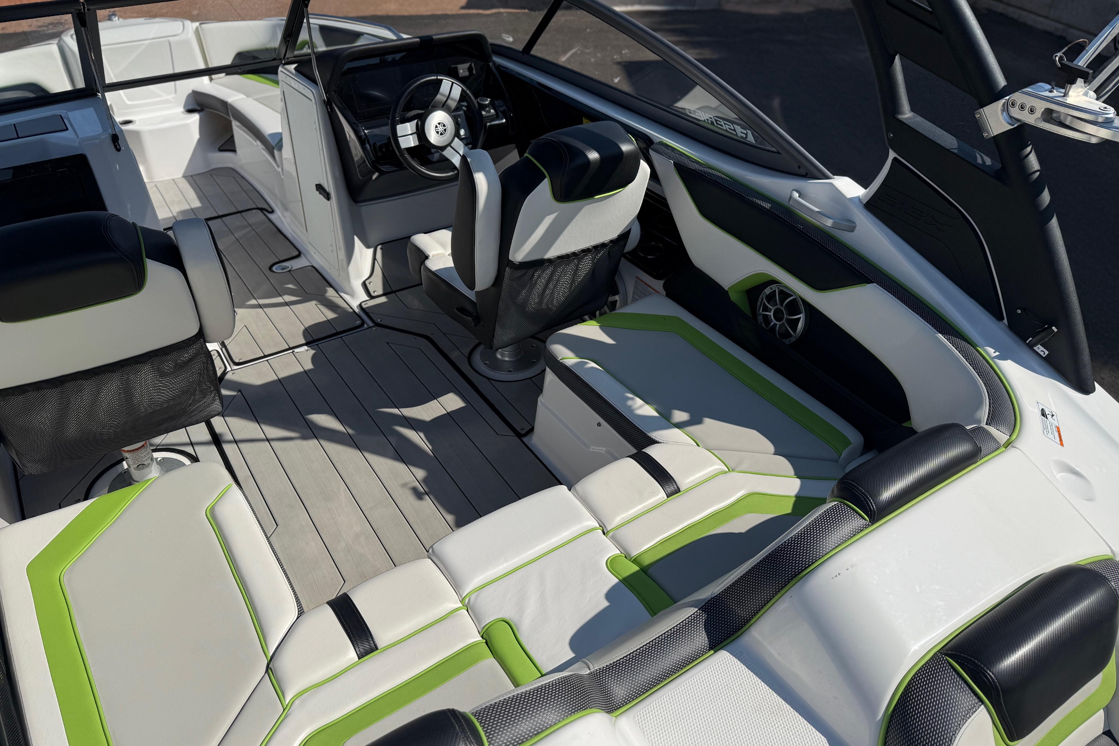 2022 Yamaha Boats 212XE interior with sleek seating and modern dashboard design.