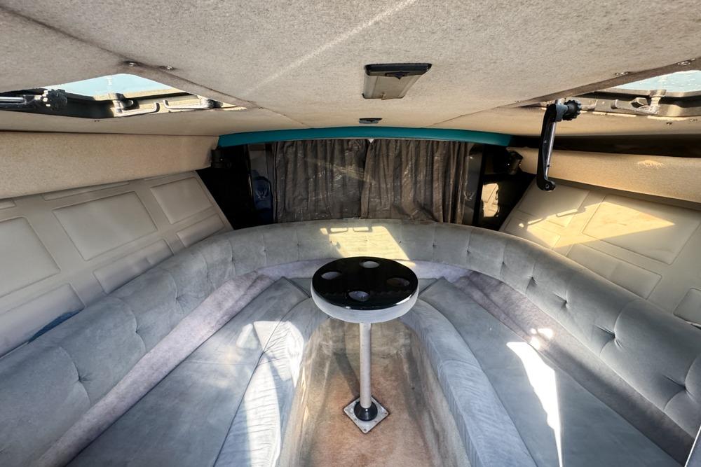 Interior of 1989 Formula 292 SR-1 boat with cozy seating and table.
