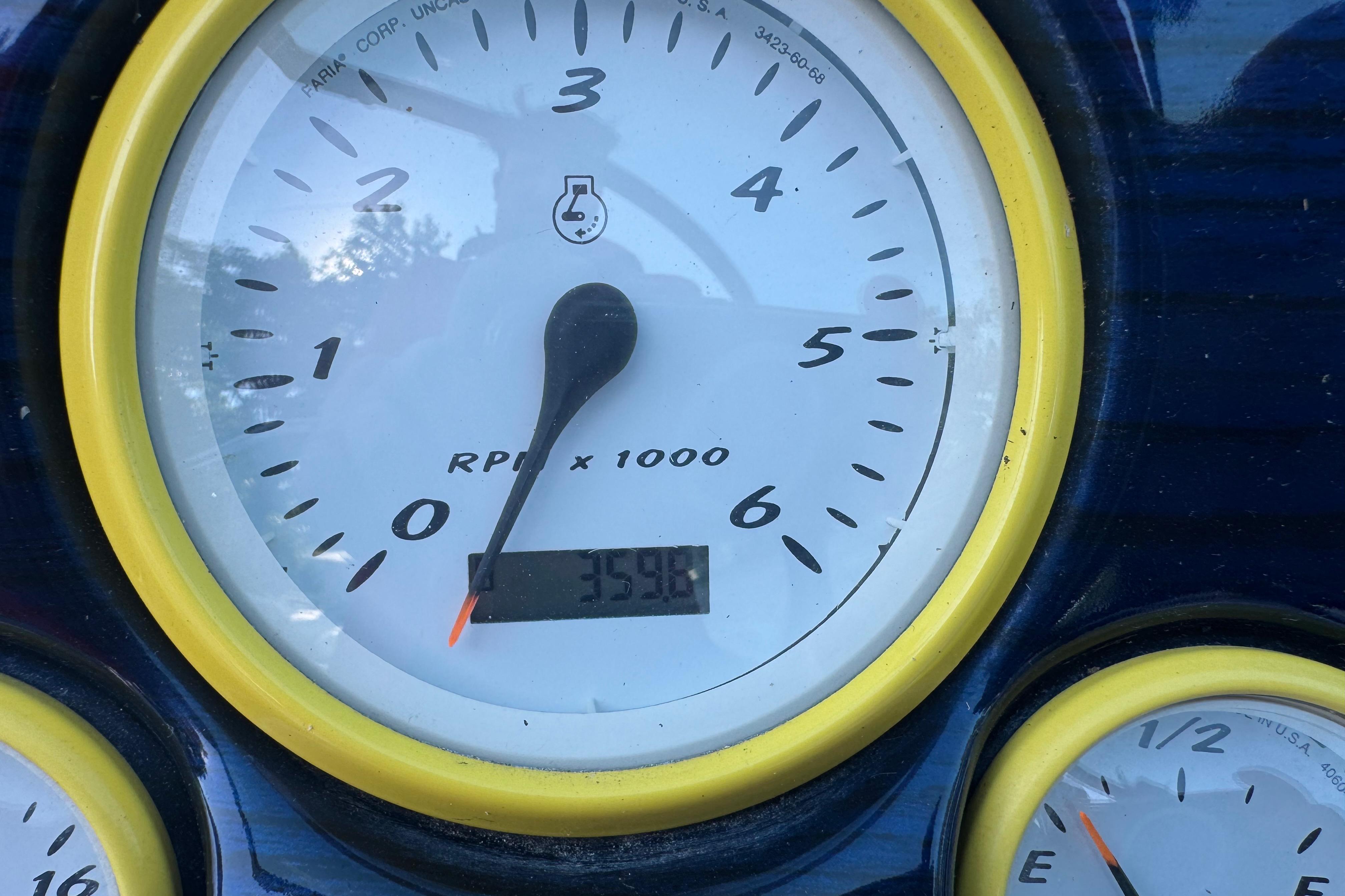 Tachometer of Monterey 268SS Super Sport showing 3598 RPM, yellow trim.