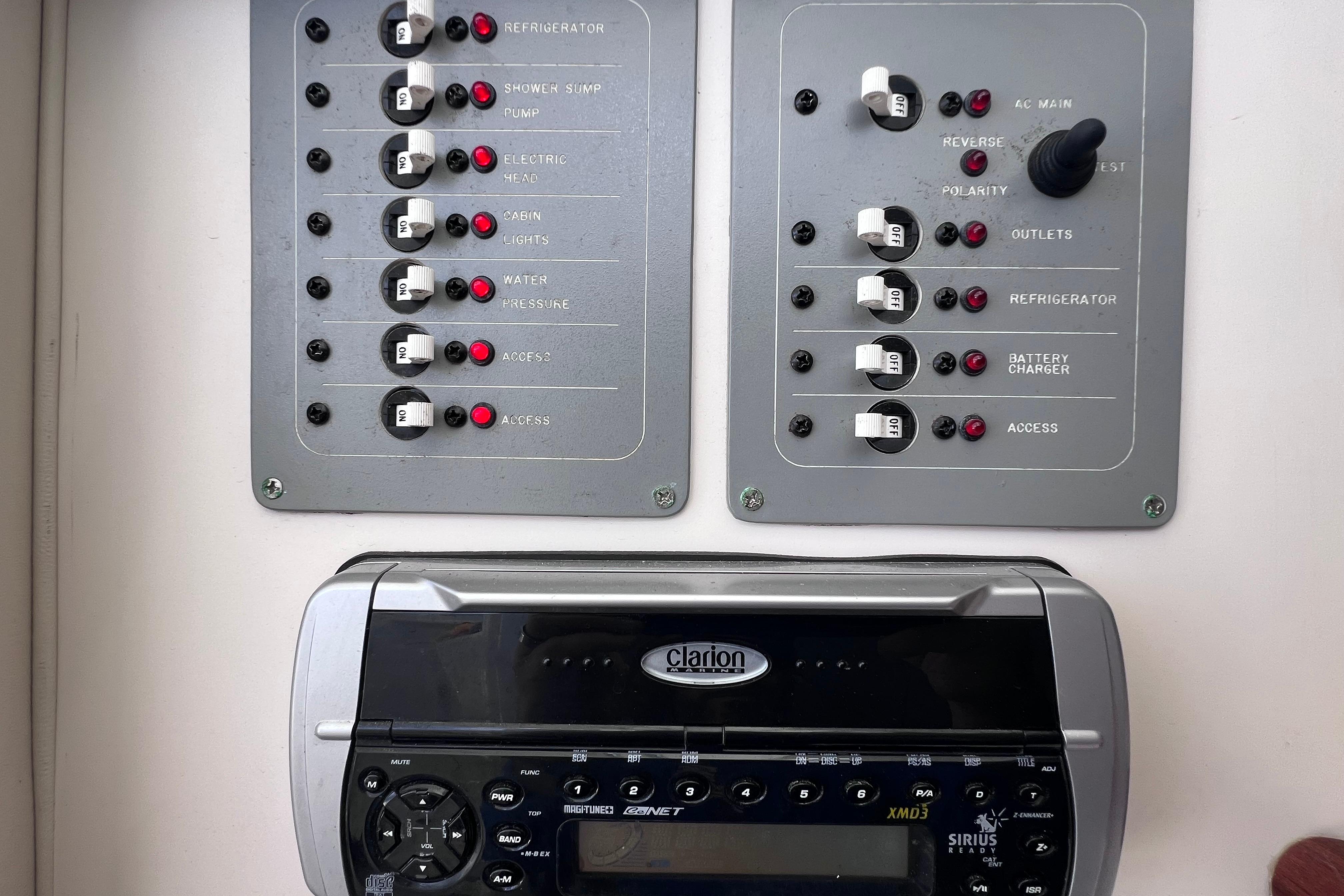 Electrical control panel and Clarion stereo system on a 2004 Pursuit 2870 Walkaround boat.
