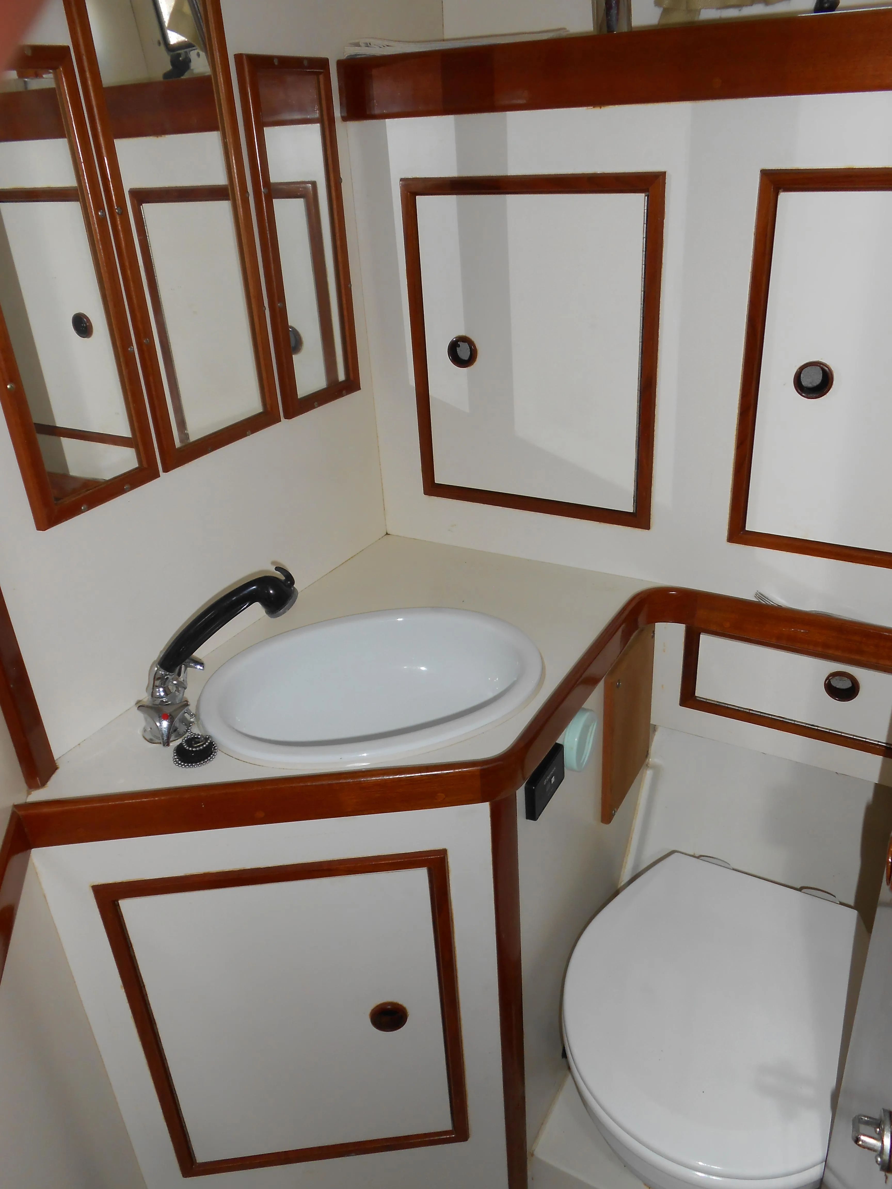Interior of a 1985 Contest 41 Ketch yacht with sink and toilet.