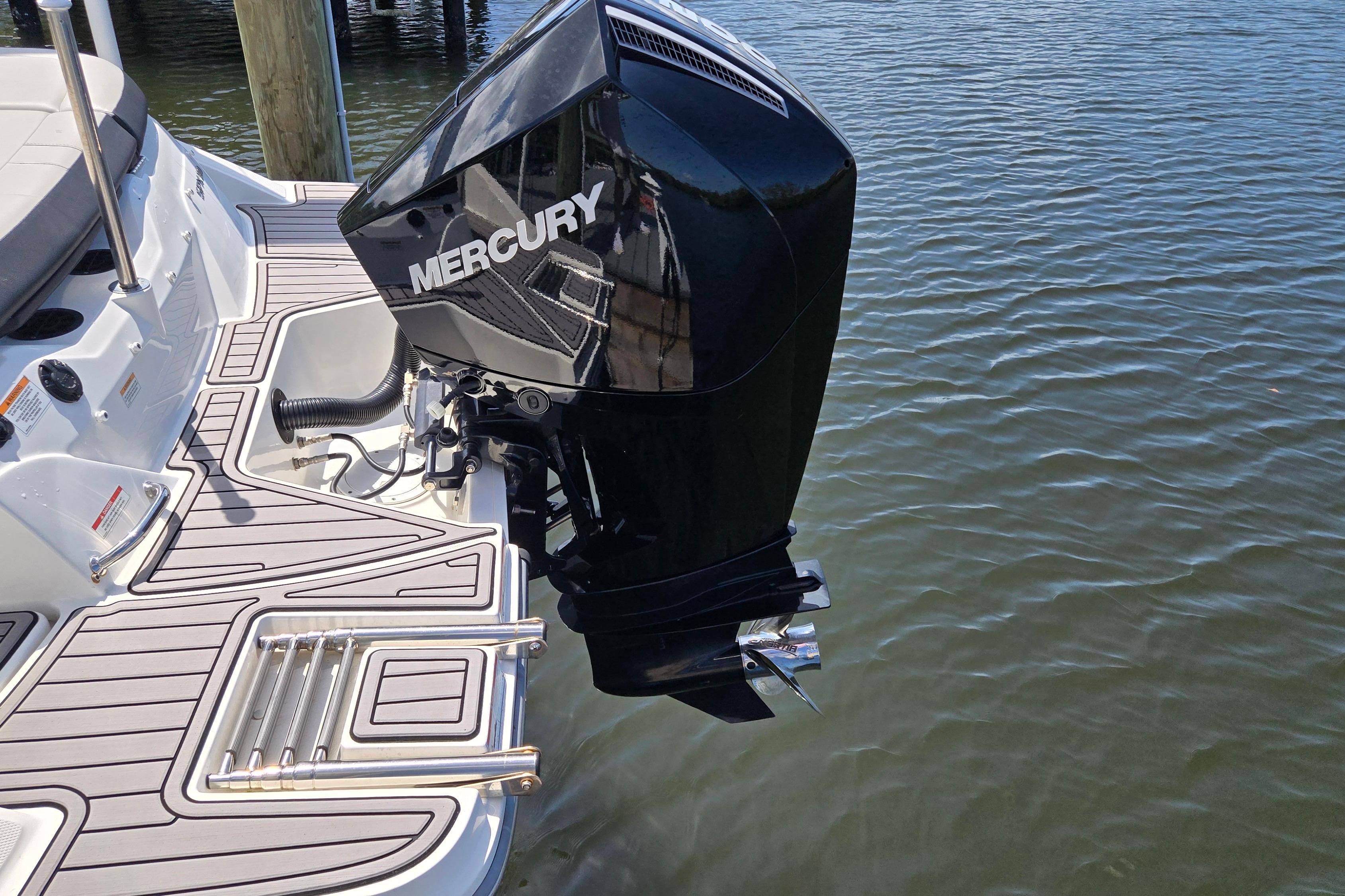 2023 Sea Ray SPX 210 boat with Mercury outboard motor on water.