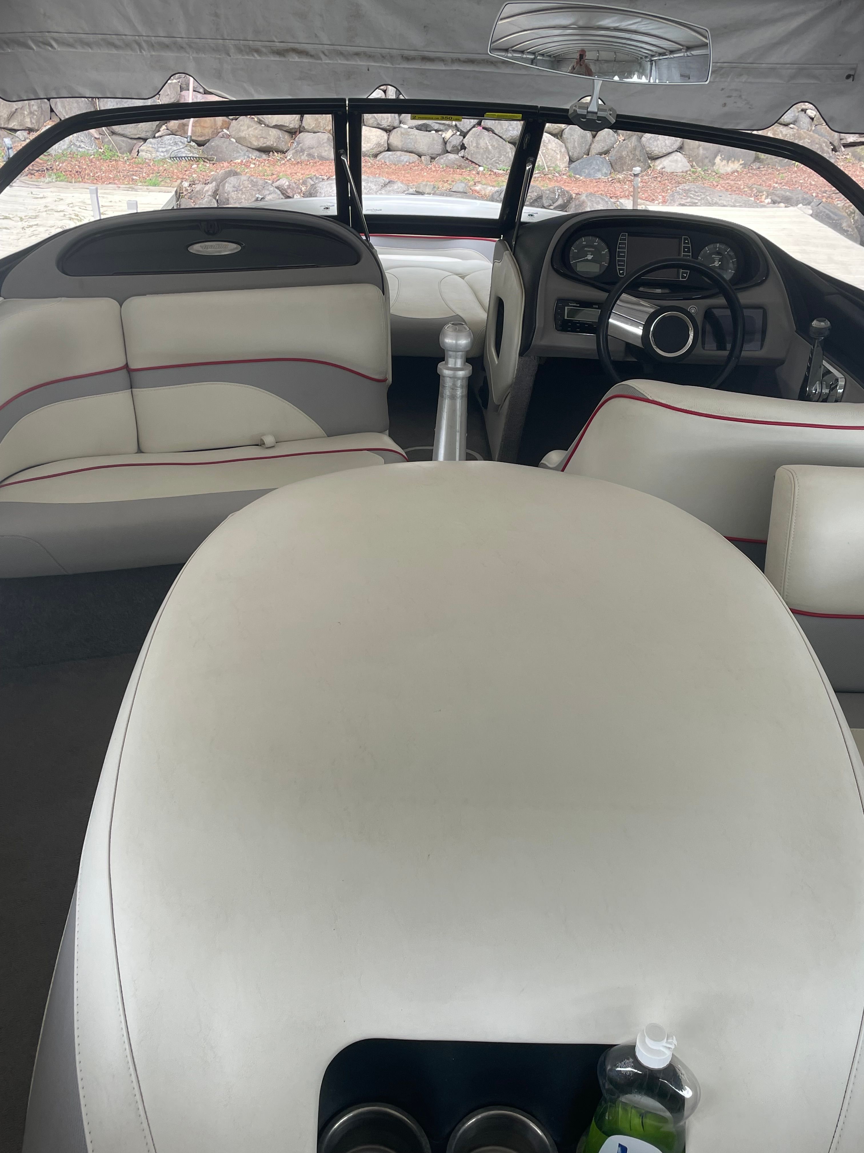 Interior of a 2014 Malibu Response TXi boat with white seating.