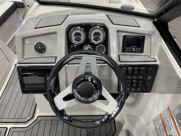 2024 Starcraft SVX 190 OB DC boat dashboard with steering wheel and control panel.