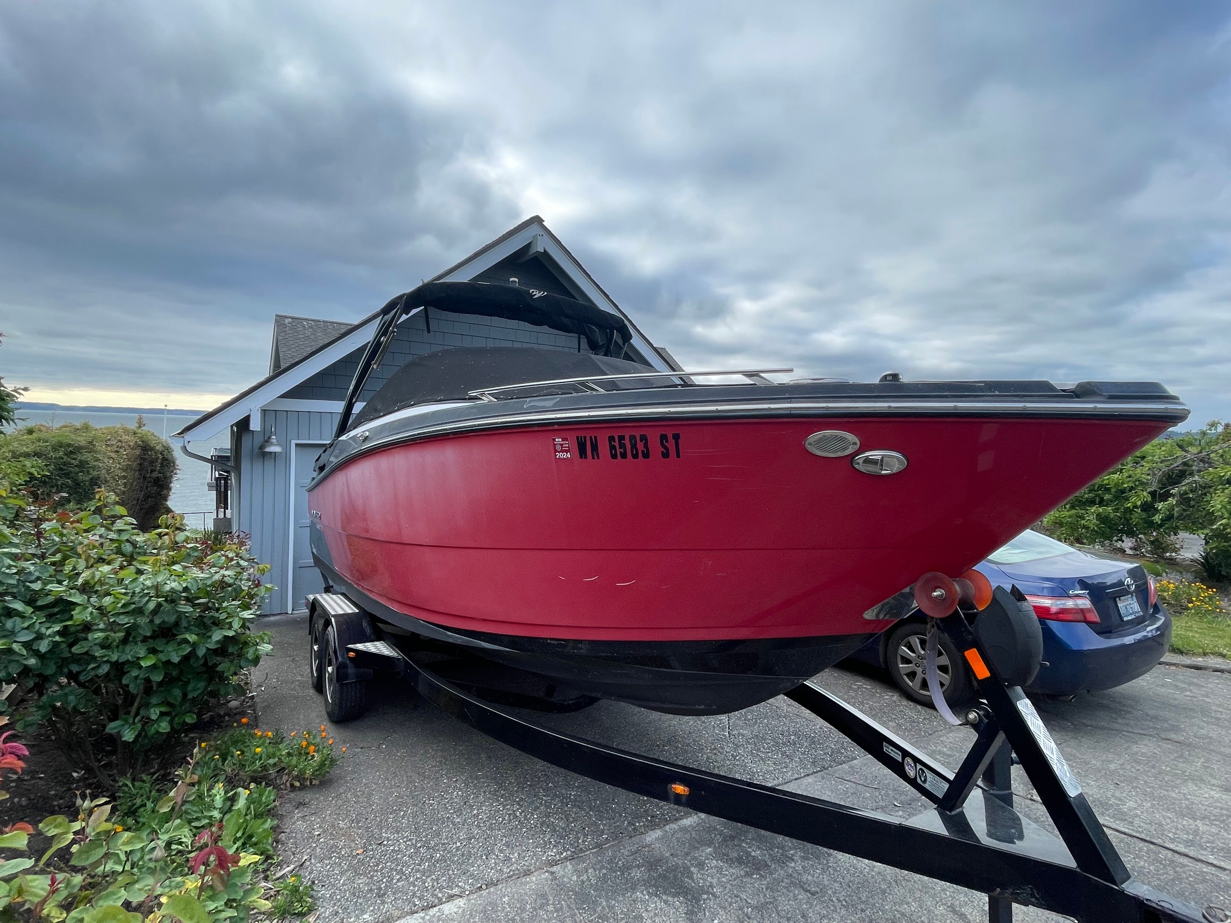 2019 Monterey 258SS Super Sport boat on trailer by house.