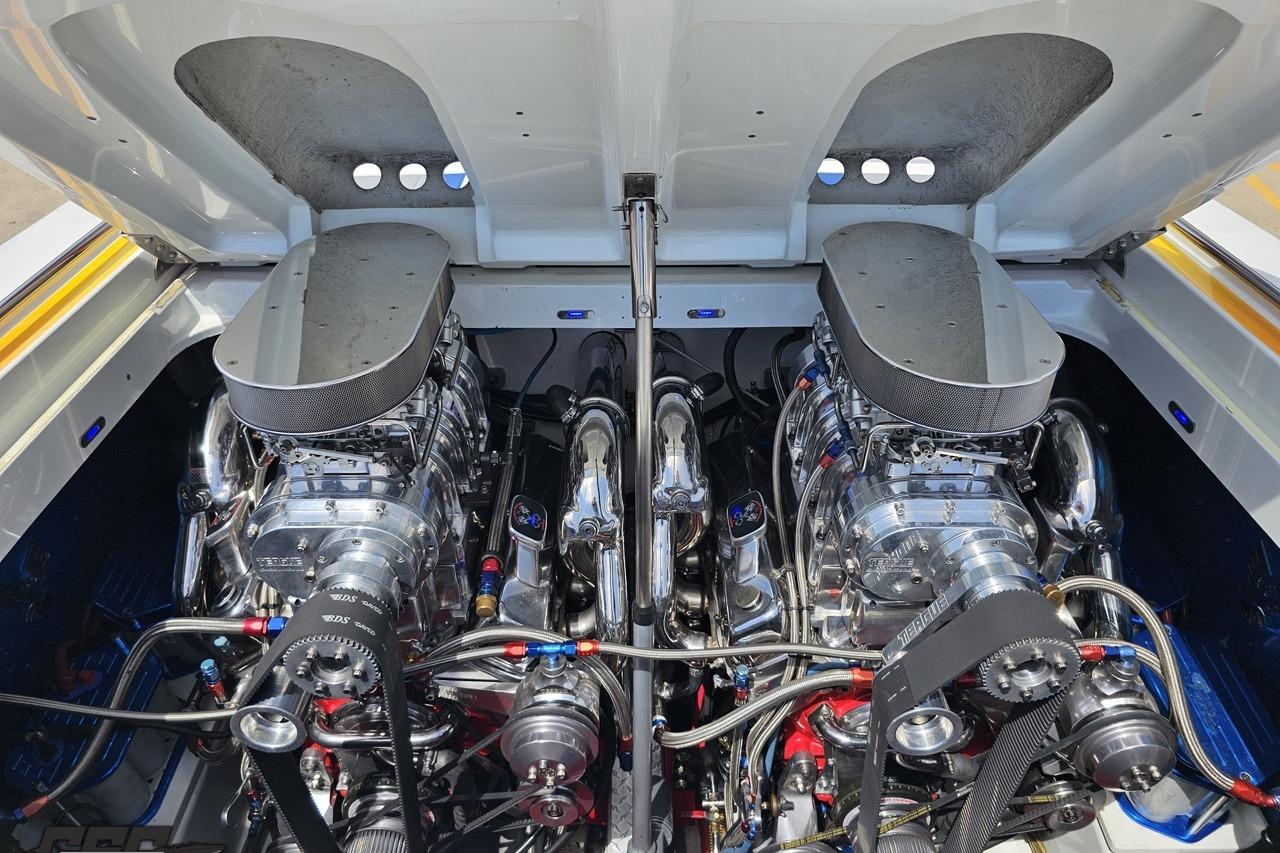 Twin high-performance engines in a 2002 Formula 382 FASTech boat, showcasing powerful engineering.