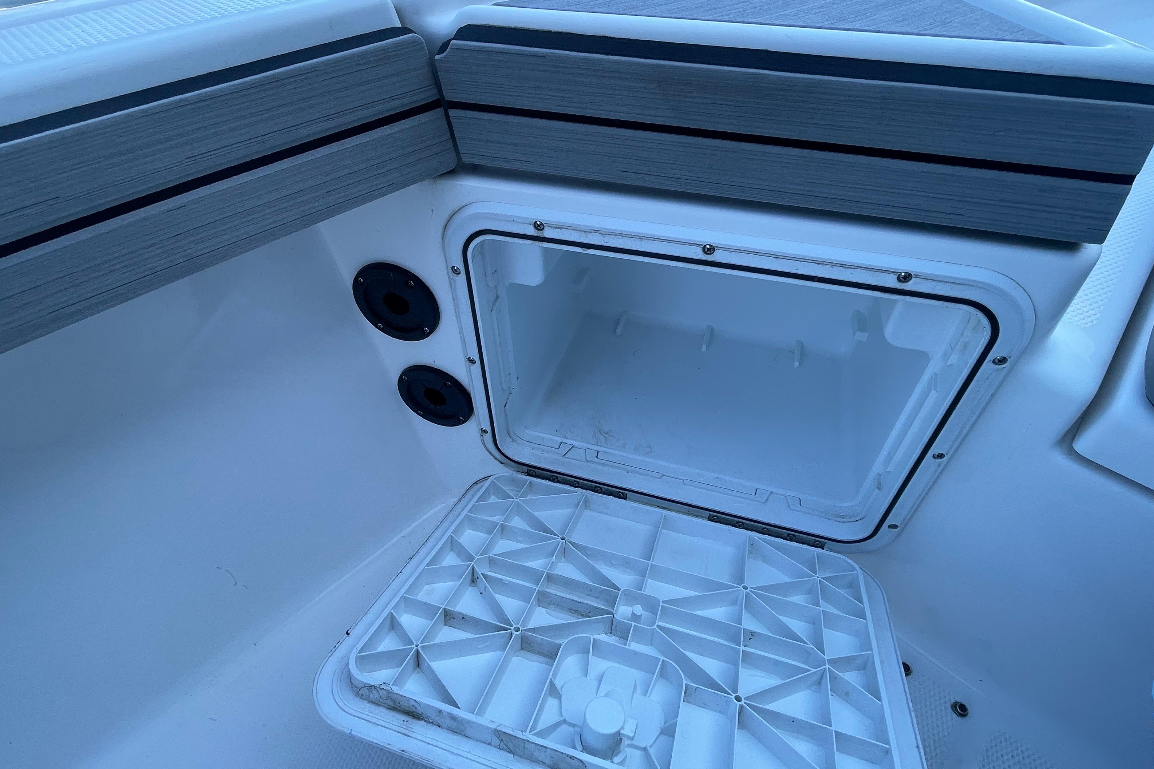 Open storage compartment on 2021 Yamaha Boats 195 FSH Sport.