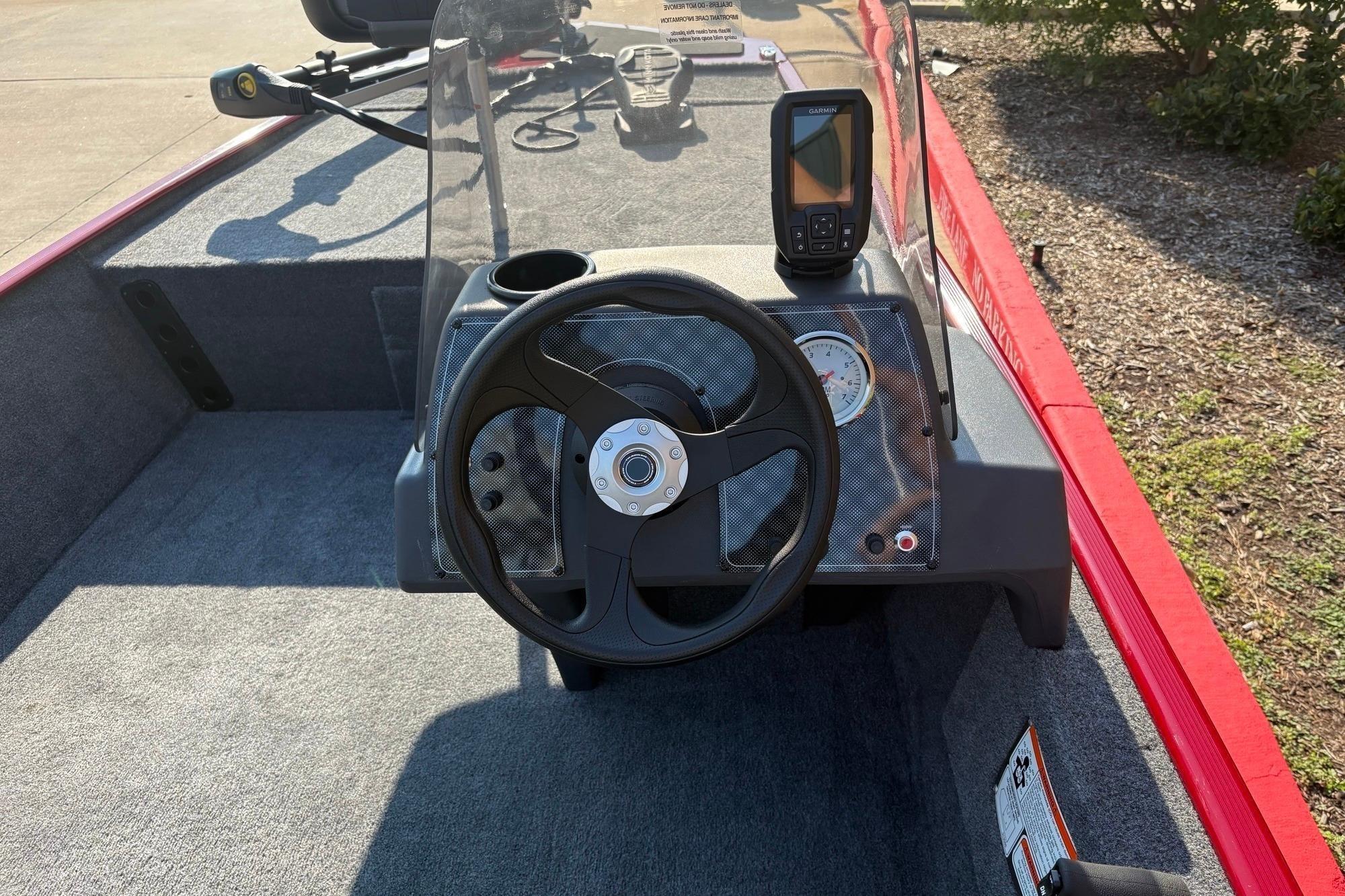 2026 Tracker Bass Tracker Classic XL boat dashboard with steering wheel and fish finder.