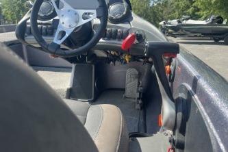 2014 Skeeter ZX200 boat cockpit with steering wheel and controls, outdoors.